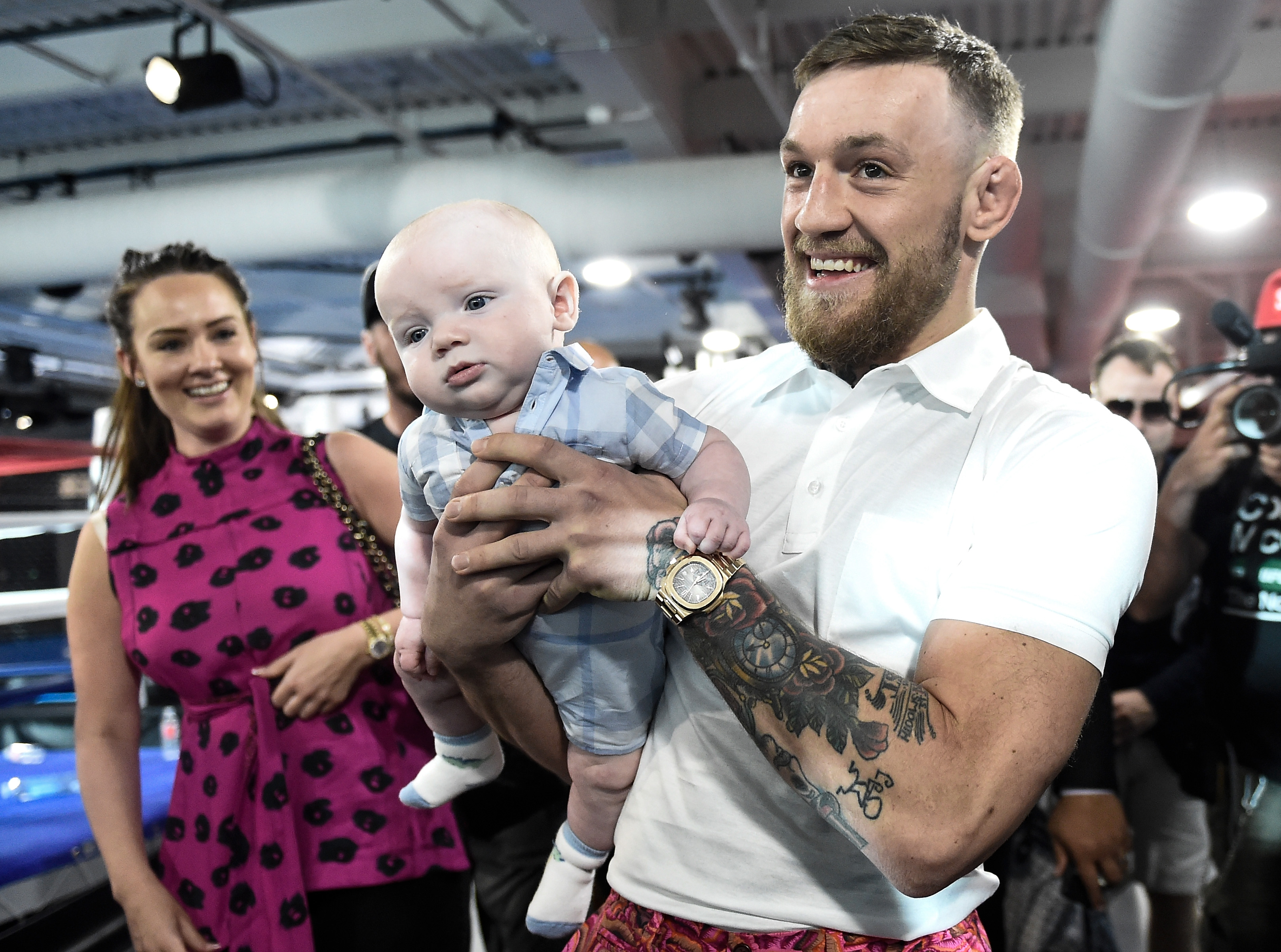 Conor McGregor and Dee Devlin with their son during the UFC star's media workout at the UFC Performance Institute on August 11, 2017, in Las Vegas, Nevada. | Source: Getty Images