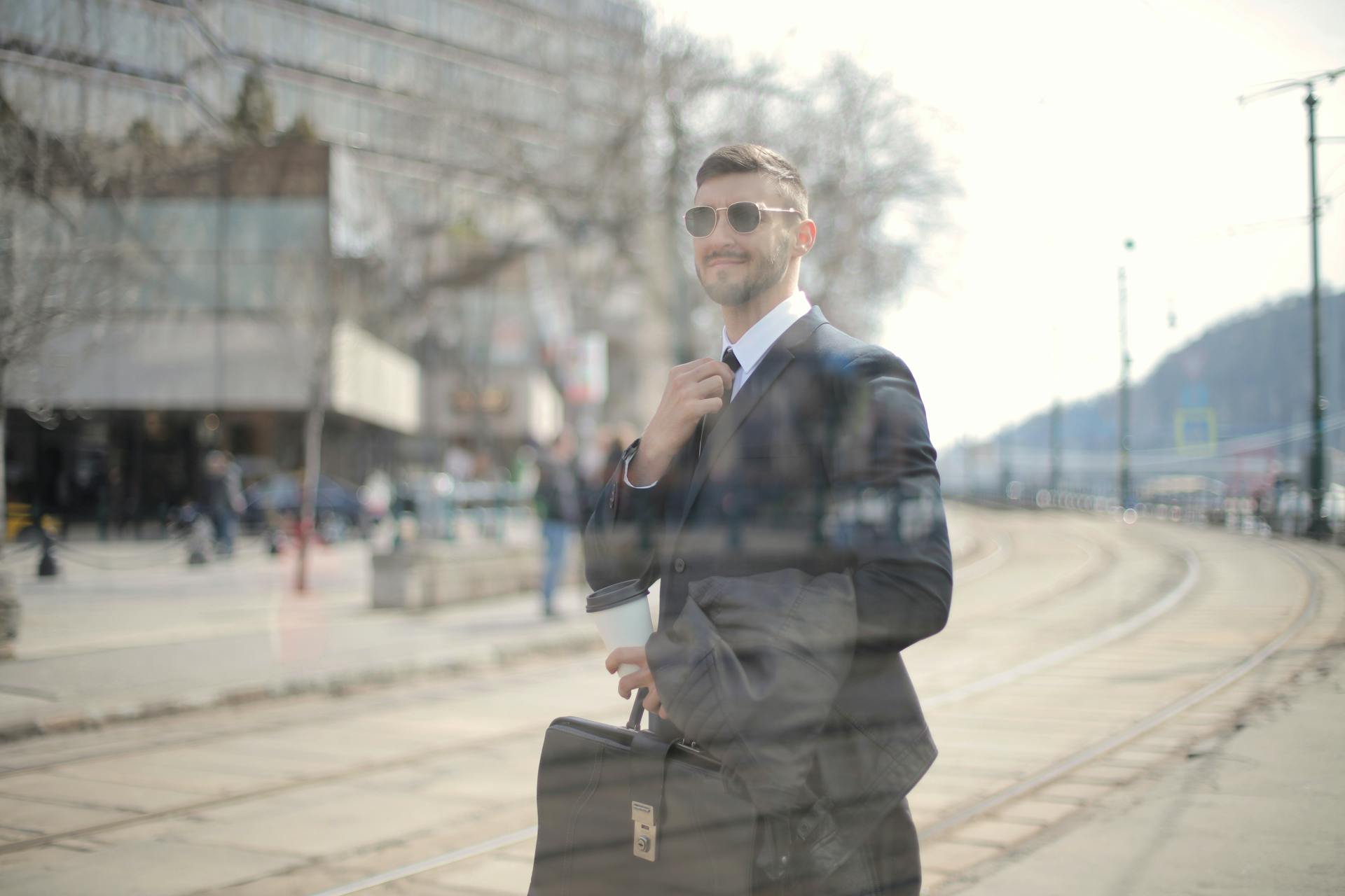 Man with black briefcase approaching a building | Source: Pexels