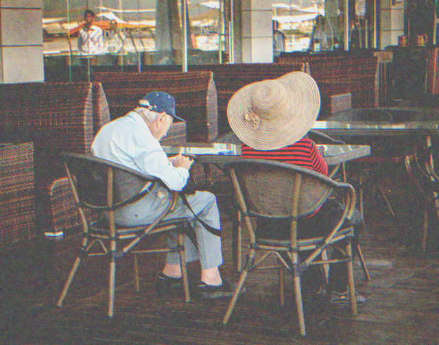 Elderly man and woman in a café | Source: Shutterstock