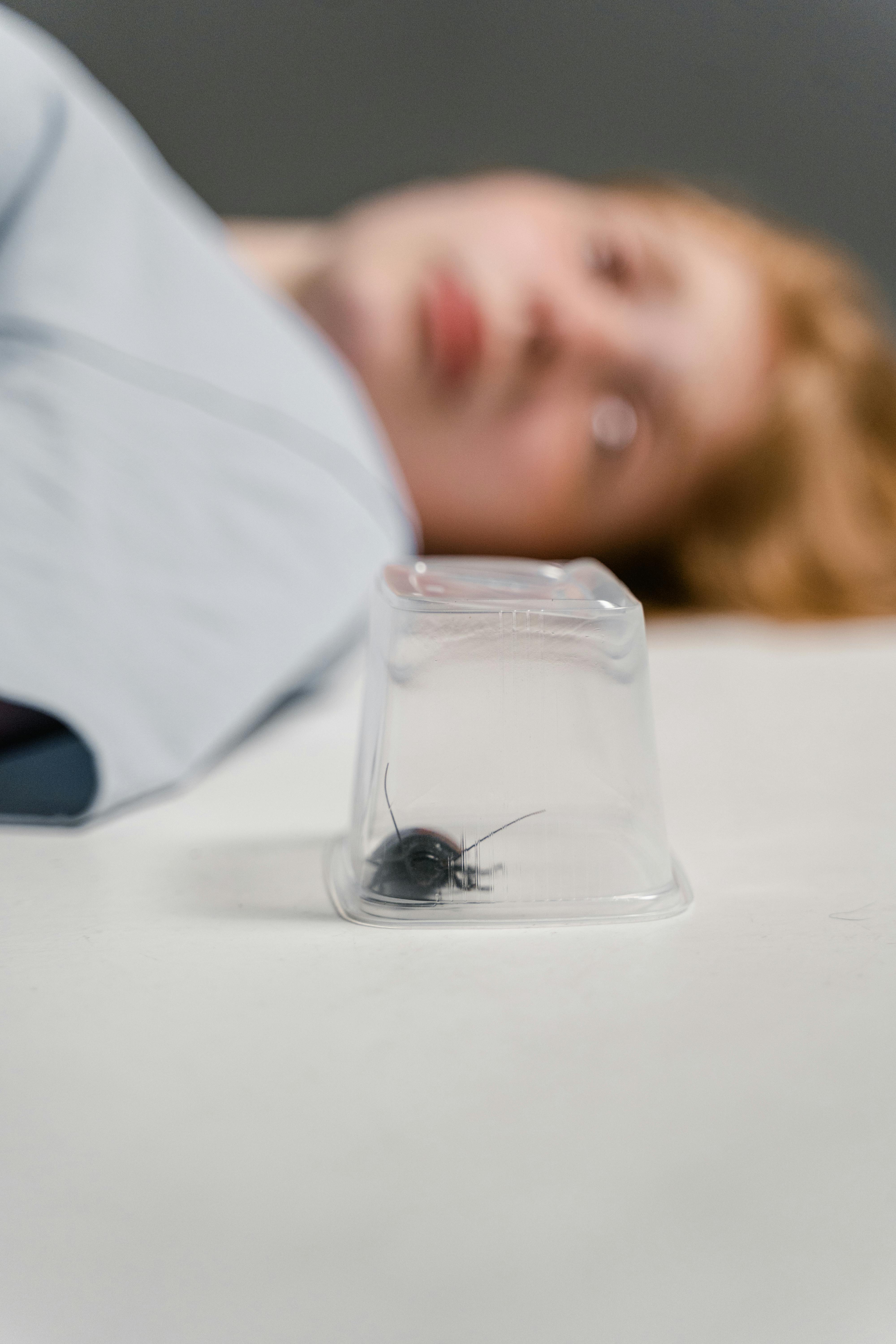 A woman watching a roach | Source: Pexels