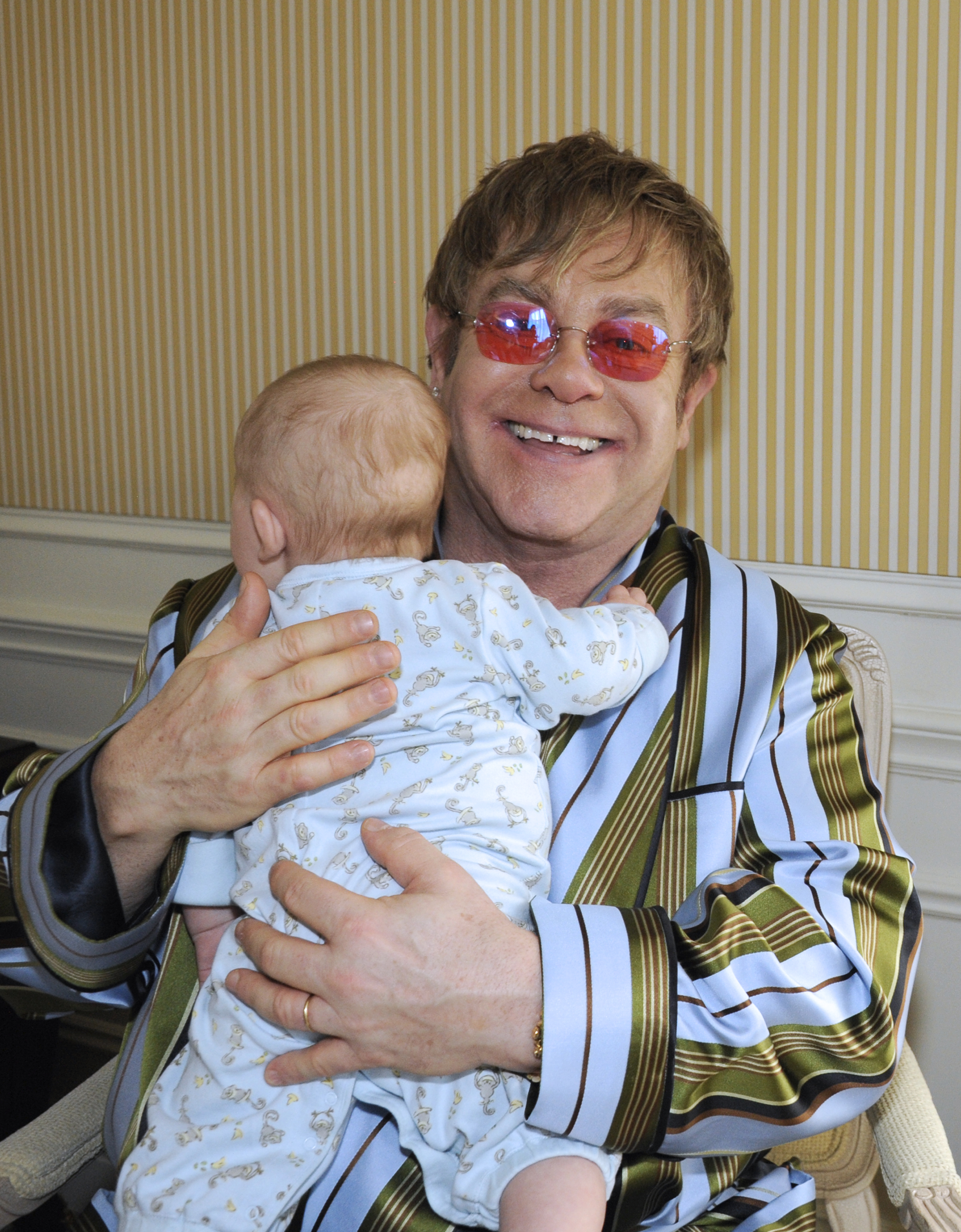 Sir Elton John seen with his son in 2011. | Source: Getty Images