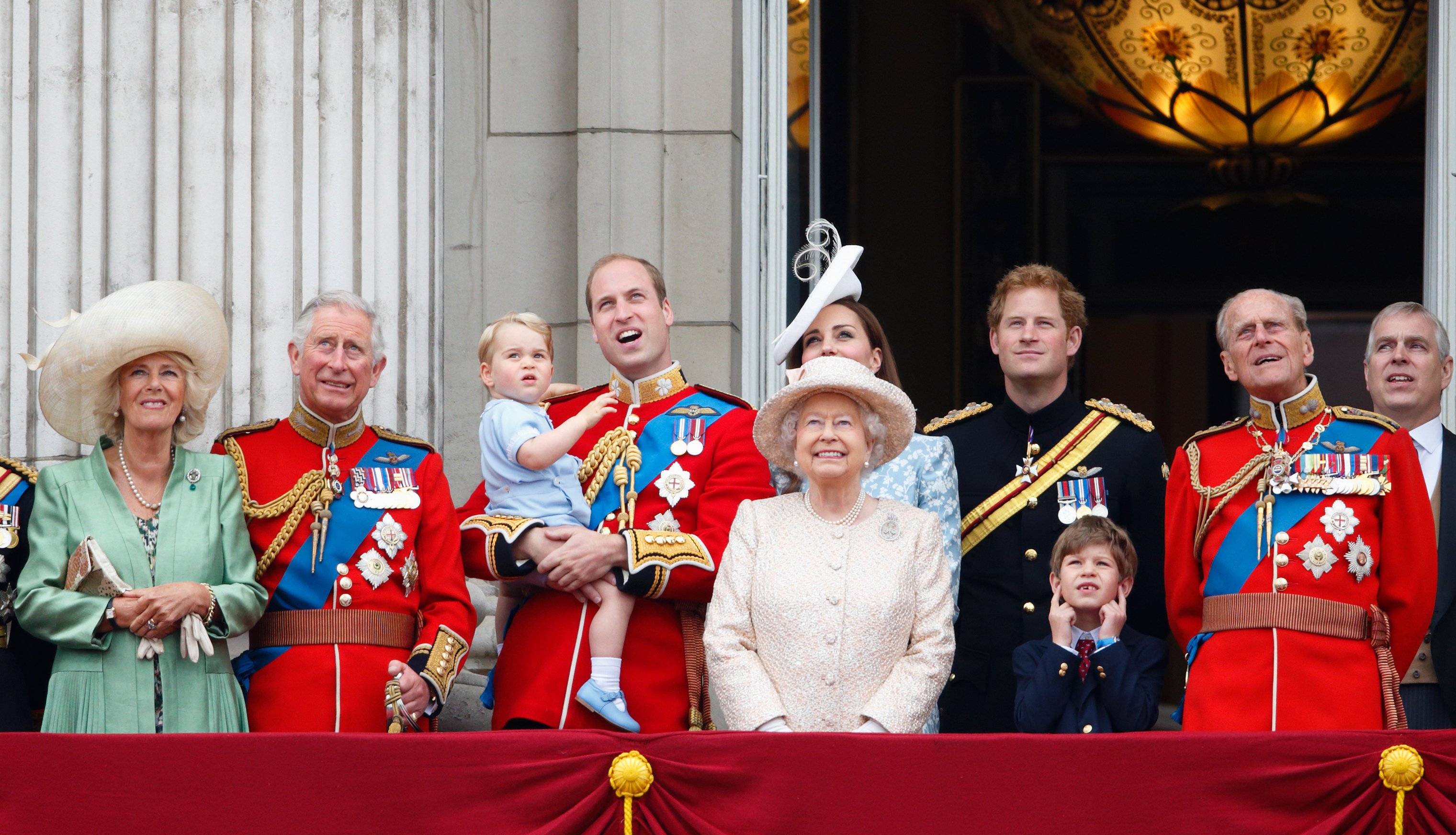 Camilla, Queen Consort, King Charle, Prince William, Prince George, Catherine, Duchess of Cambridge, Queen Elizabeth II, Prince Harry, James, Viscount Severn, and Prince Philip, Duke of Edinburgh stand on the balcony of Buckingham Palace during Trooping the Colour on June 13, 2015, in London, England. | Source: Getty Images