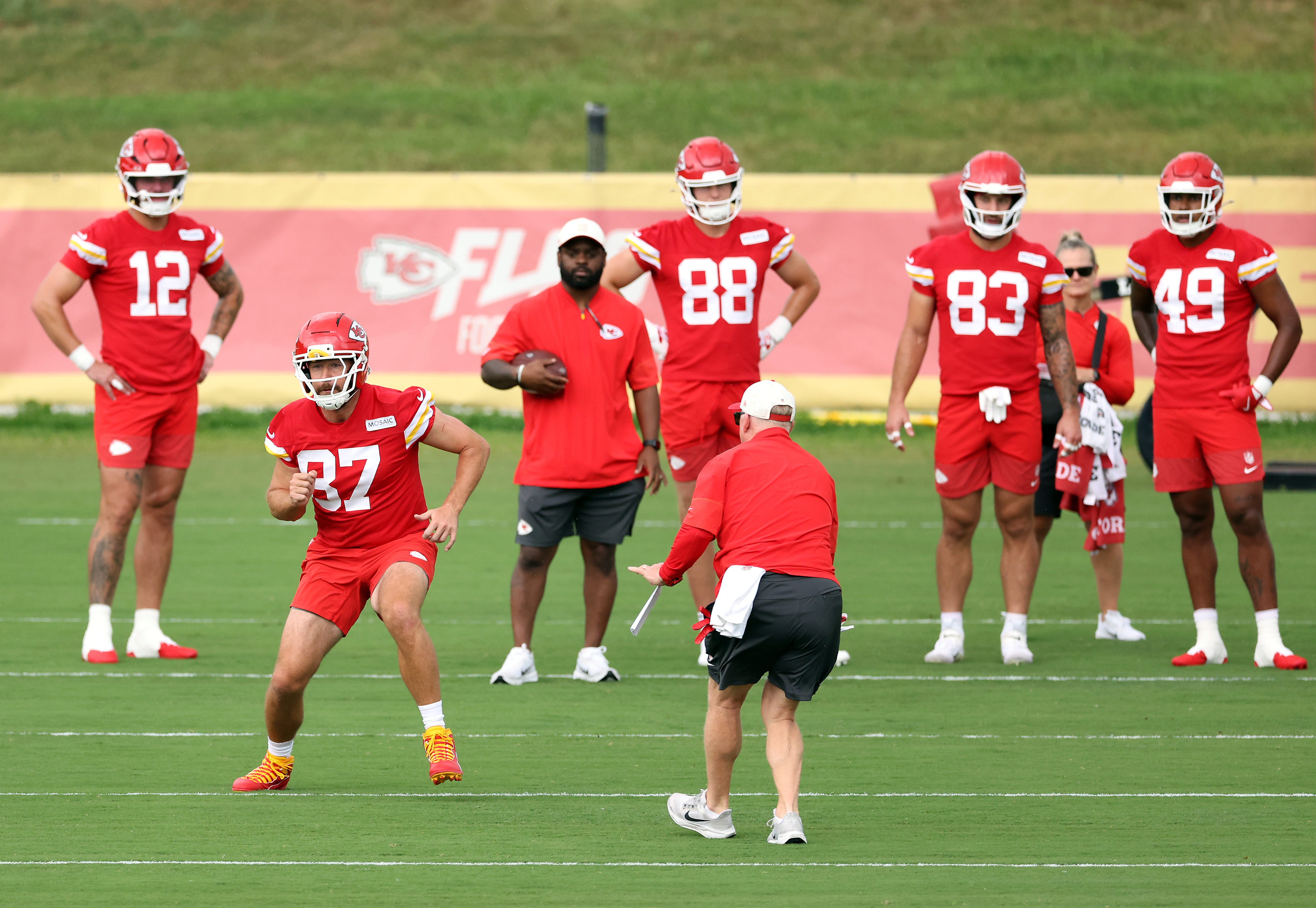 Travis Kelce works through a drill during the Chiefs' first training camp practices as attention surrounding his offseason gives way to preparations for the new NFL season. | Source: Getty Images