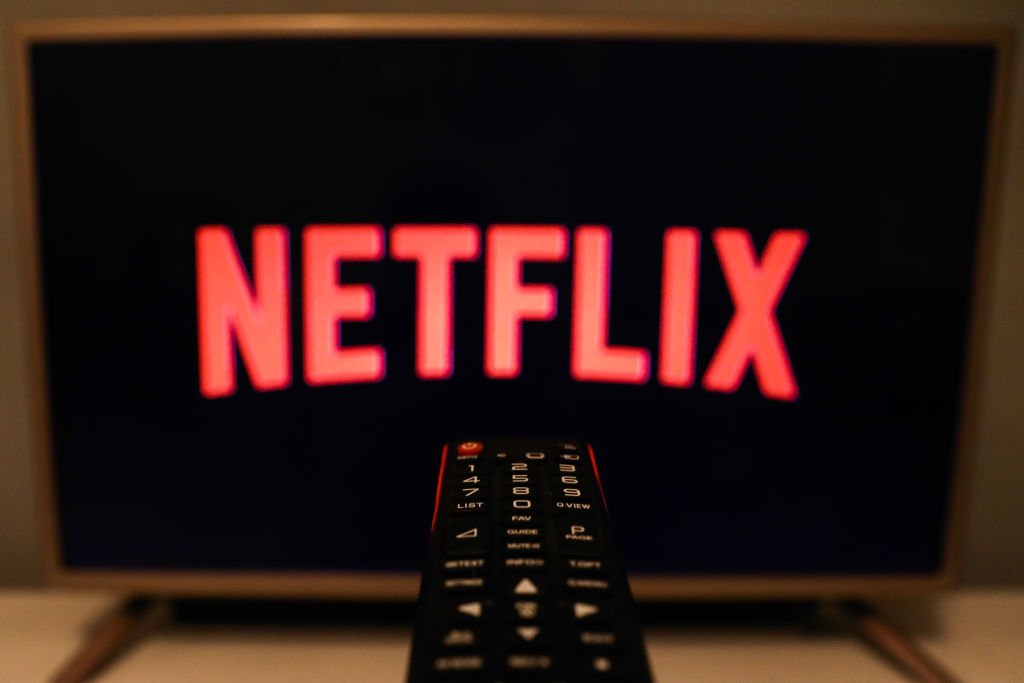 Netflix logo is seen displayed on a TV screen | Photo: Getty Image
