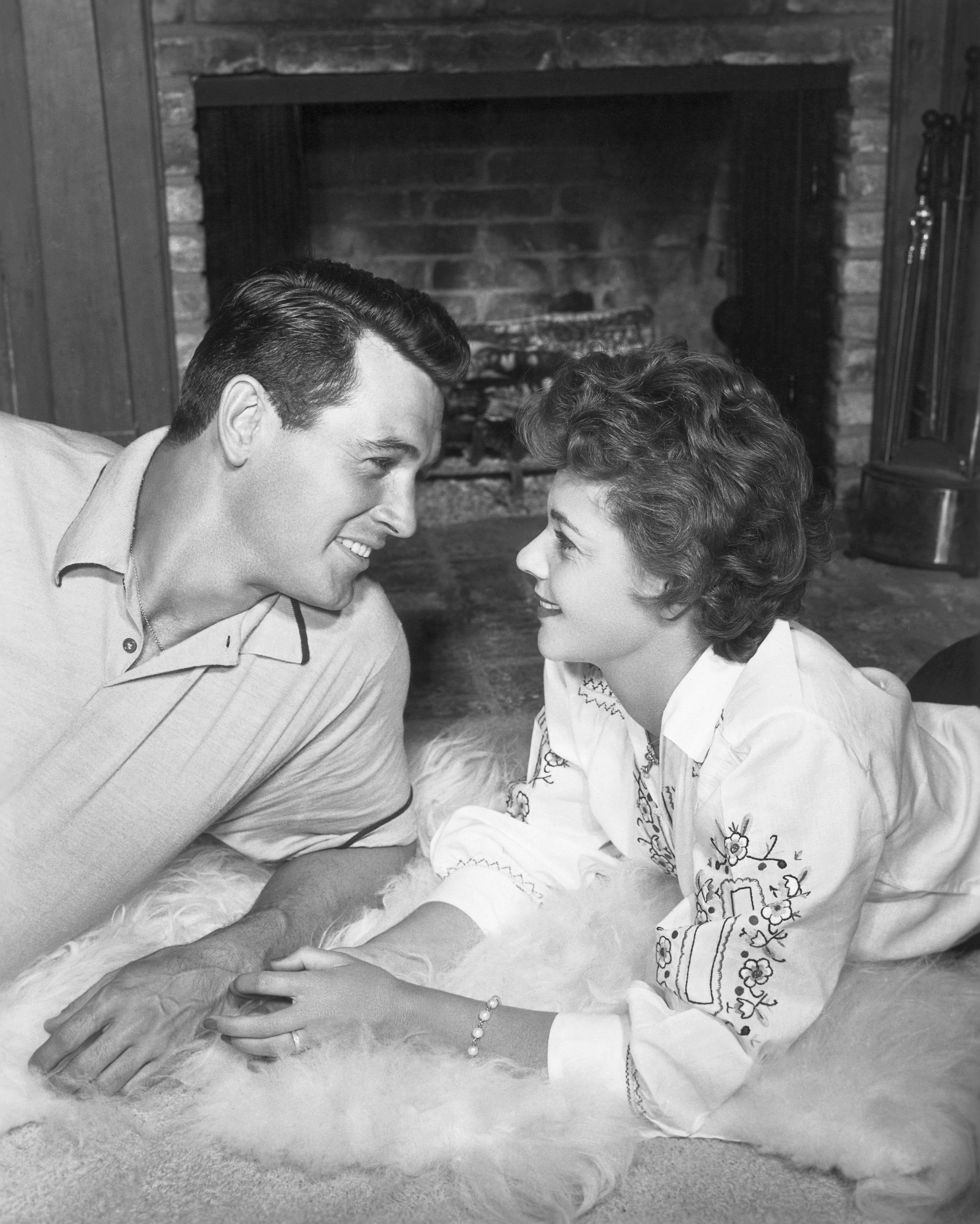 Rock Hudson and Phyllis Gates posing for a picture less than a month after they married in their honeymoon house in Hollywood | Source: Getty Images