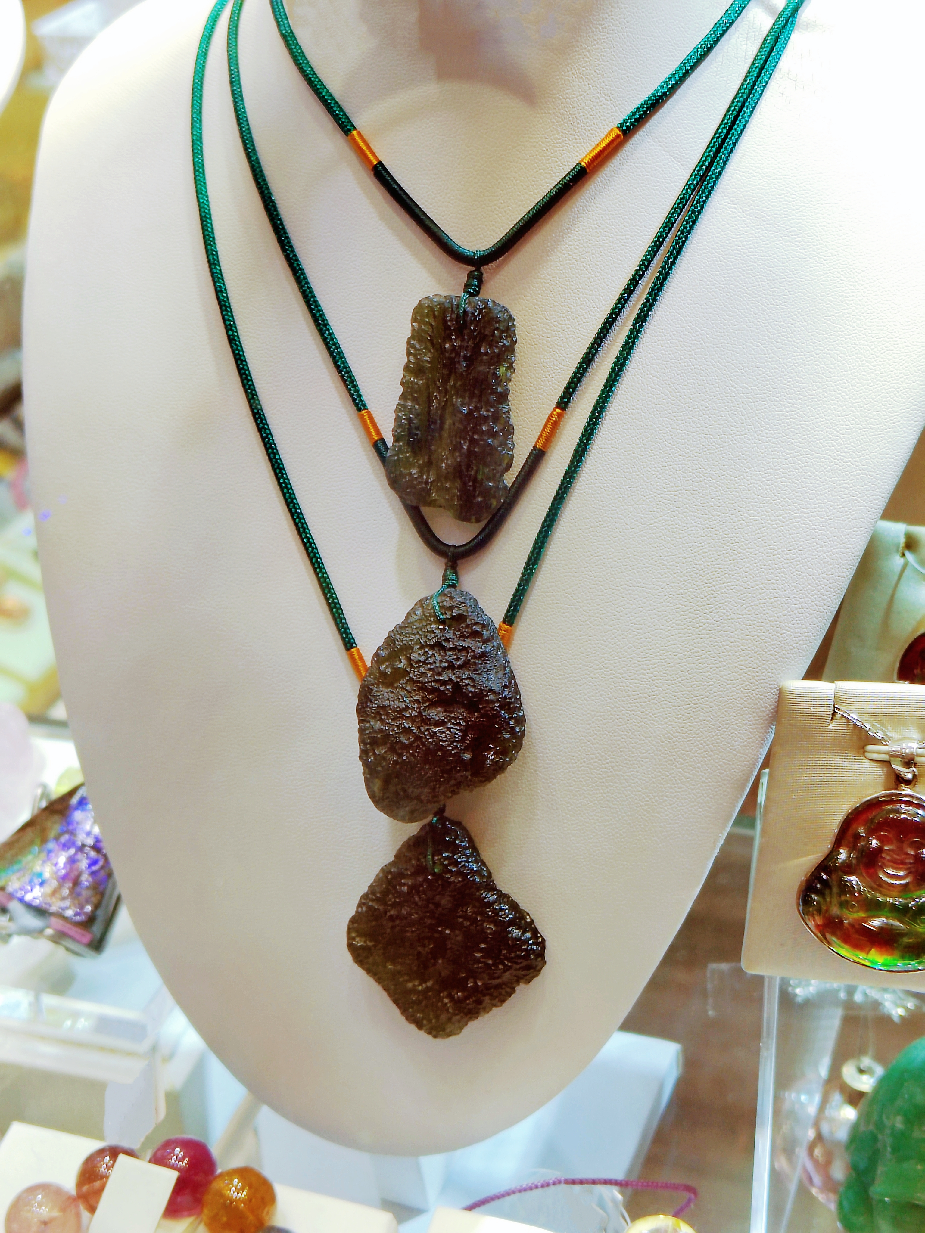 Photo of moldavite used in a three-tiered necklace | Source: Getty Images