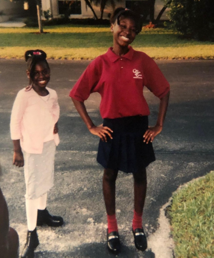 Beaming with confidence on her first day of 6th grade, Nancy Metayer Bowen stands proudly in her school uniform at Coral Springs Charter School, hands on her hips as she poses on a quiet neighborhood street, from a post dated August 14, 2019. | Source: Instagram/nancymetayerbowen