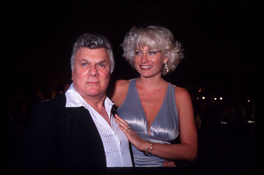 Tony Curtis and wife Jill Vandenberg at the opening of Planet Hollywood in 1995 | Source: Getty Images