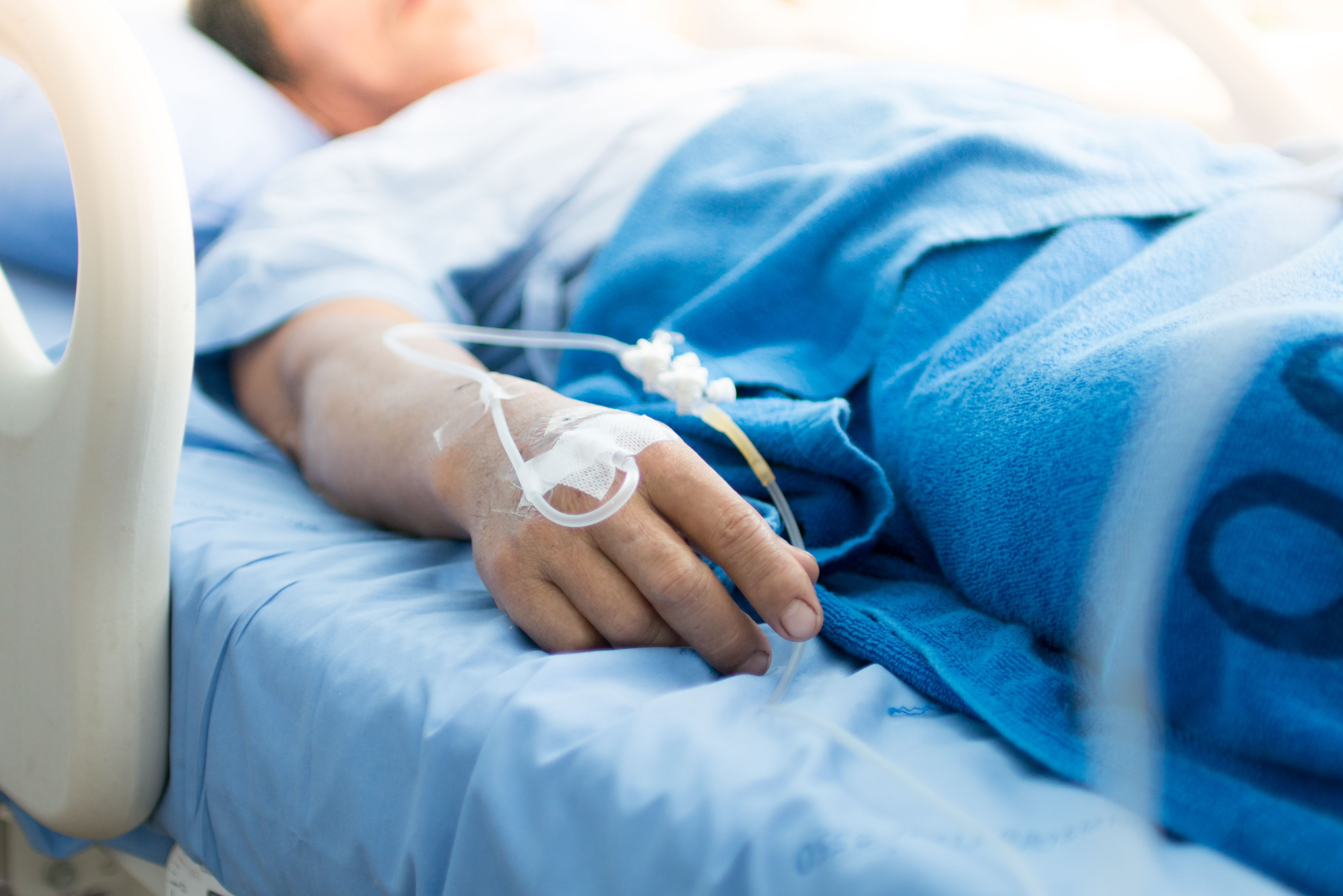 A sick patient on a hospital bed | Source: Shutterstock