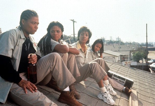 Queen Latifah, Kimberly Elise, Vivica Fox and Jada Pinkett all sitting on the roof of a house on 'Set It Off' | Photo: Getty Images