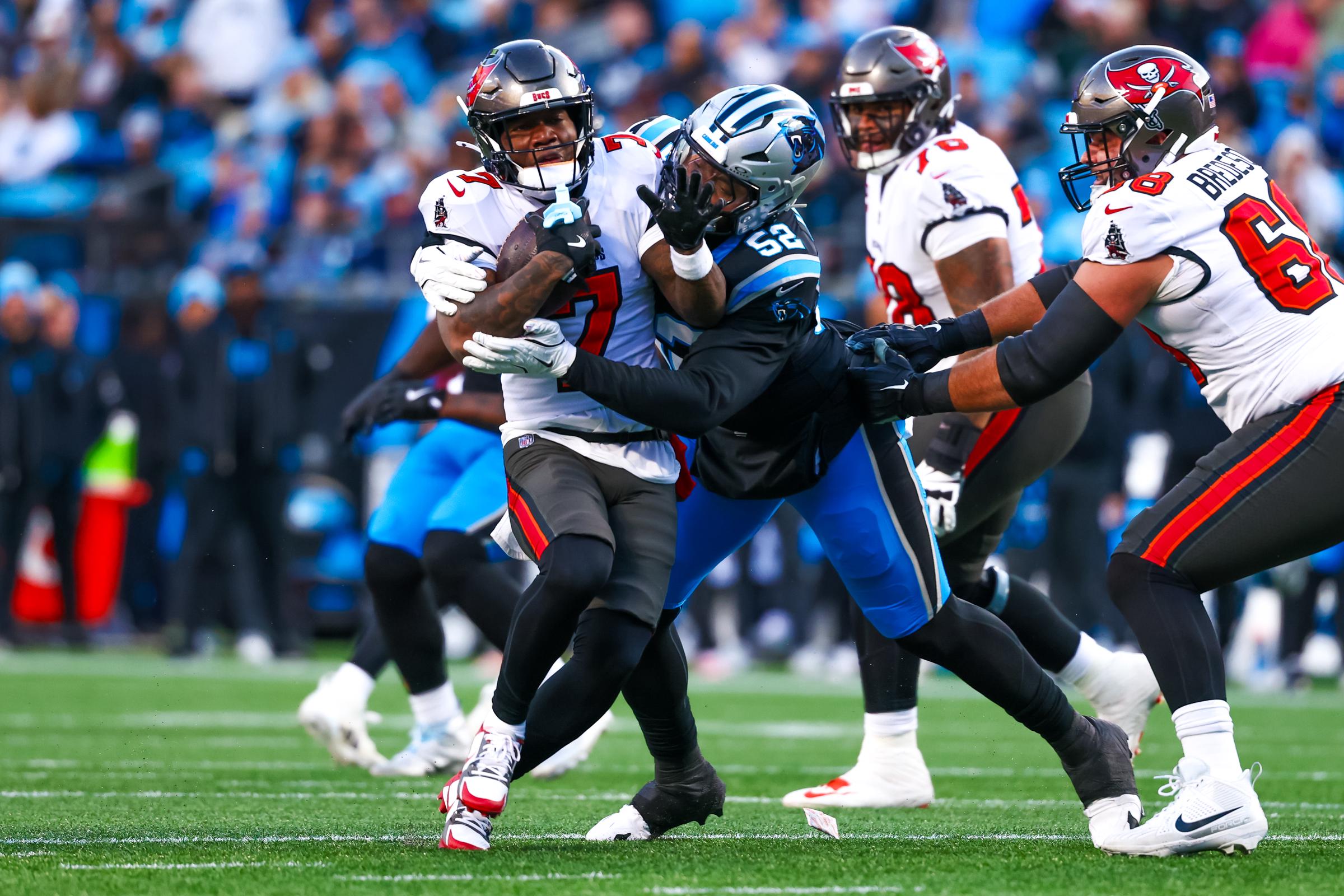 Tampa Bay Buccaneers run the ball against the Carolina Panthers at Bank of America Stadium in Charlotte, North Carolina, on December 1, 2024 | Source: Getty Images