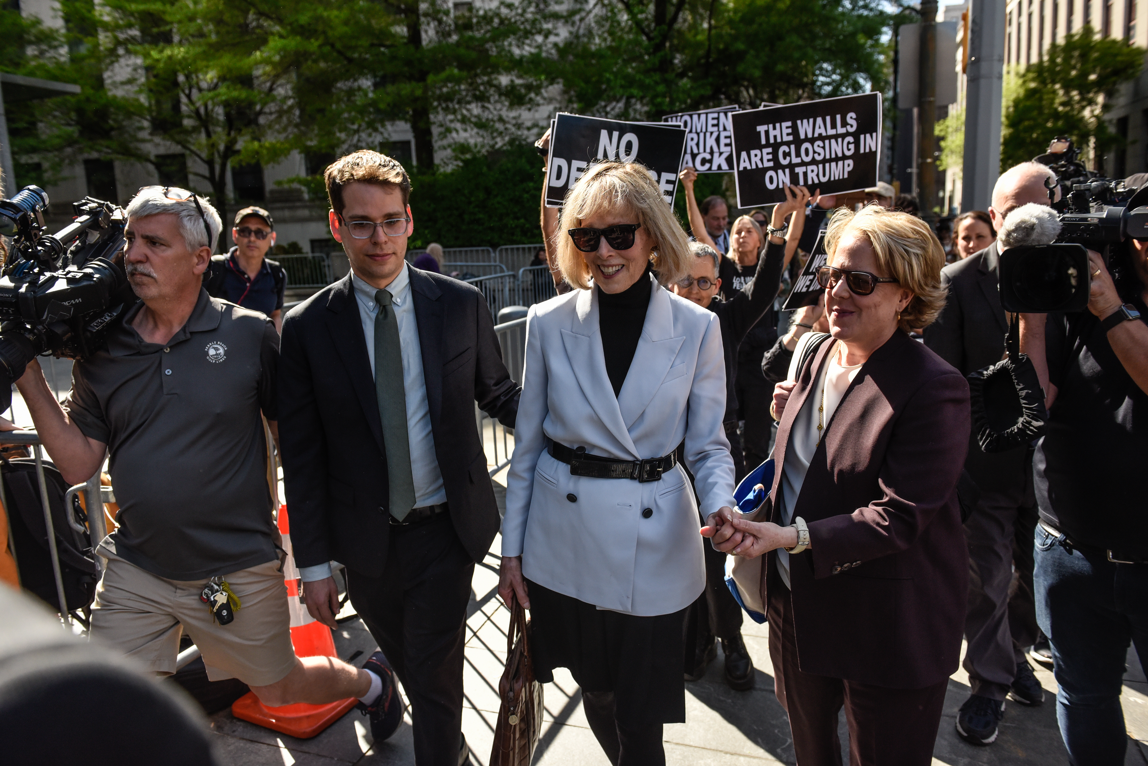 E. Jean Carroll (C) pictured leaving following her trial at Manhattan Federal Court on May 8, 2023, in New York City | Source: Getty Images