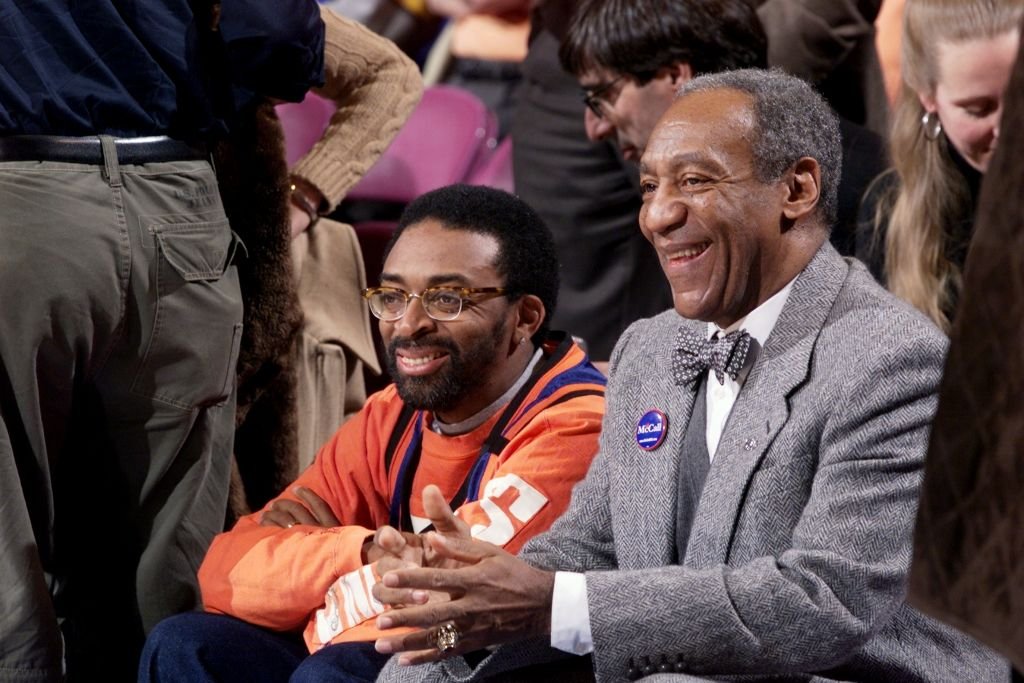 Spike Lee and Bill Cosby smile on while sitting next to each other as they the New York Knicks play the Philadelphia 76ers at Madison Square Garden | Source: Corey Sipkin/NY Daily News Archive via Getty Images