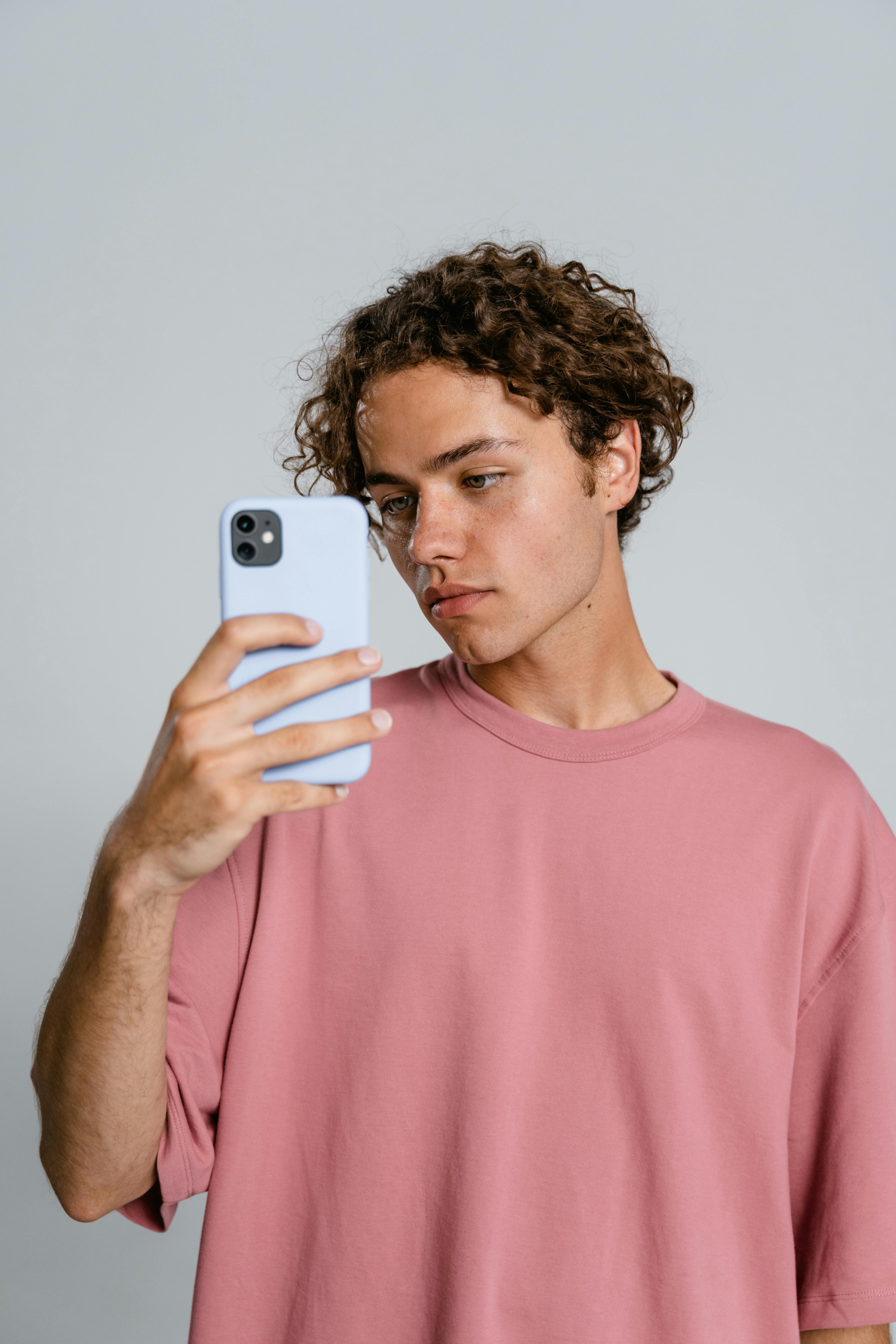 A teen on his phone | Source: Pexels