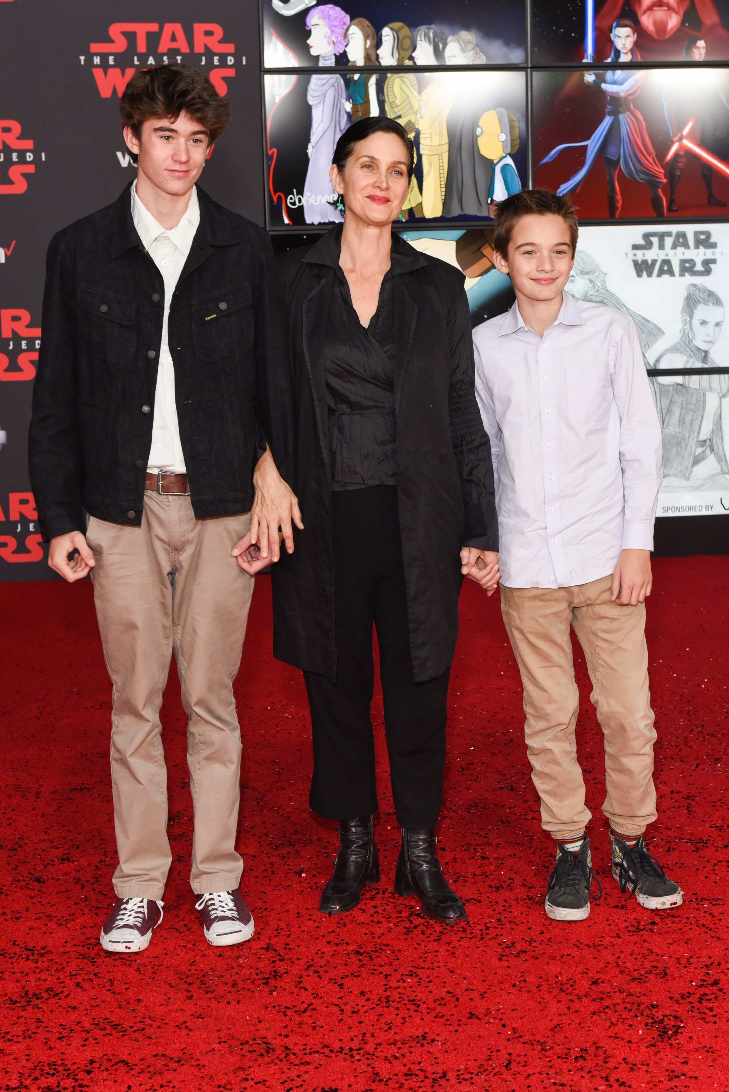 Carrie-Anne Moss and sons Owen and Jaden attend the premiere of "Star Wars: The Last Jedi" at The Shrine Auditorium on December 9, 2017 in Los Angeles, California┃Source: Getty Images