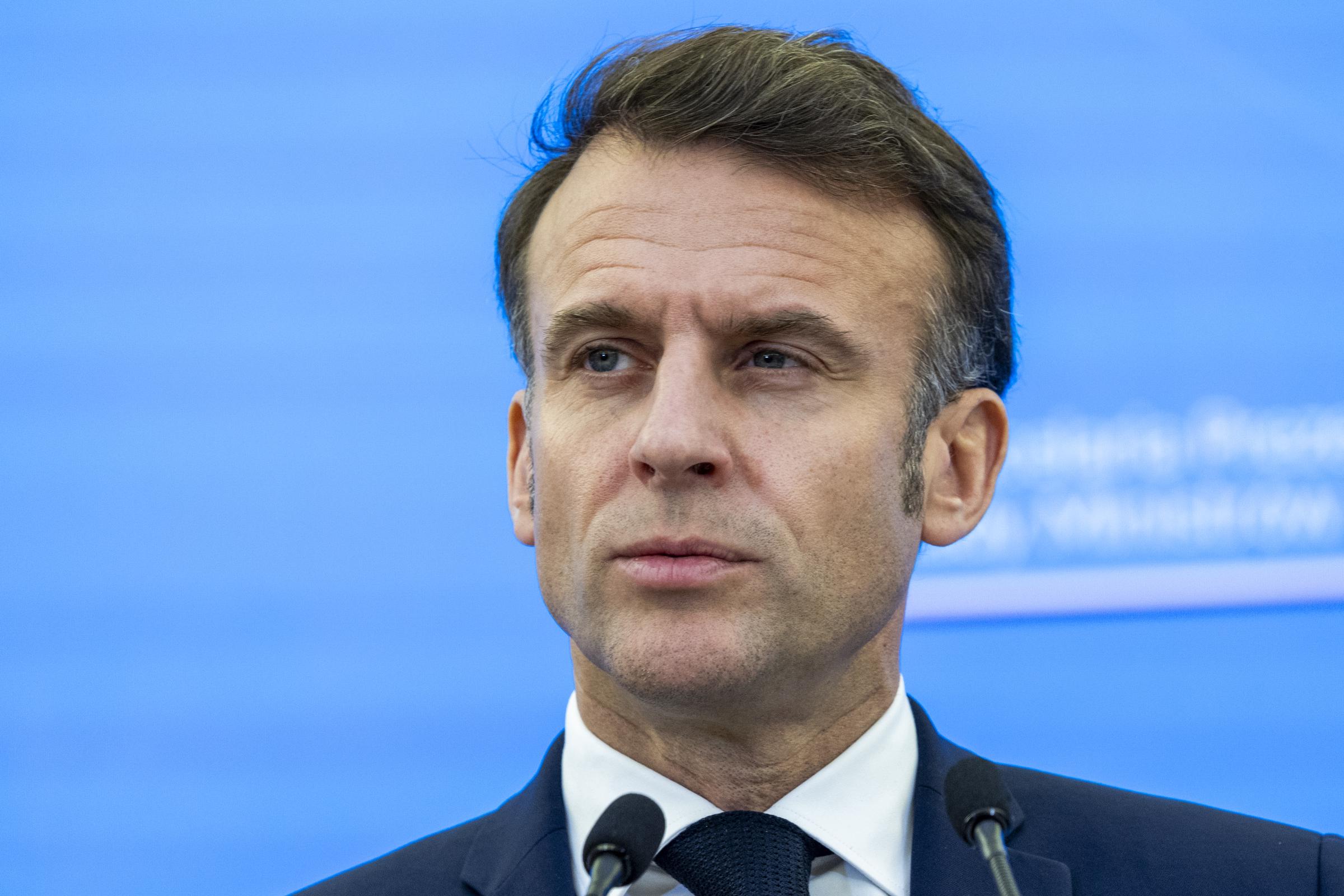 Emmanuel Macron speaking to the press on December 12, 2024, in Warsaw, Poland. | Source: Getty Images