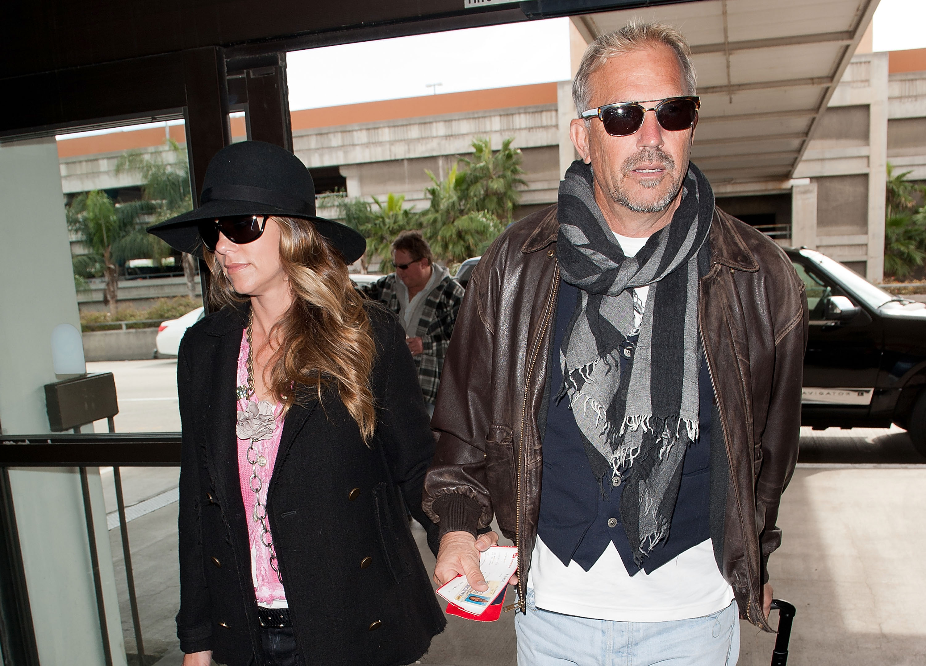Christine Baumgartner and Kevin Costner are seen at Los Angeles International Airport on February 17, 2011, in, California. | Source: Getty Images
