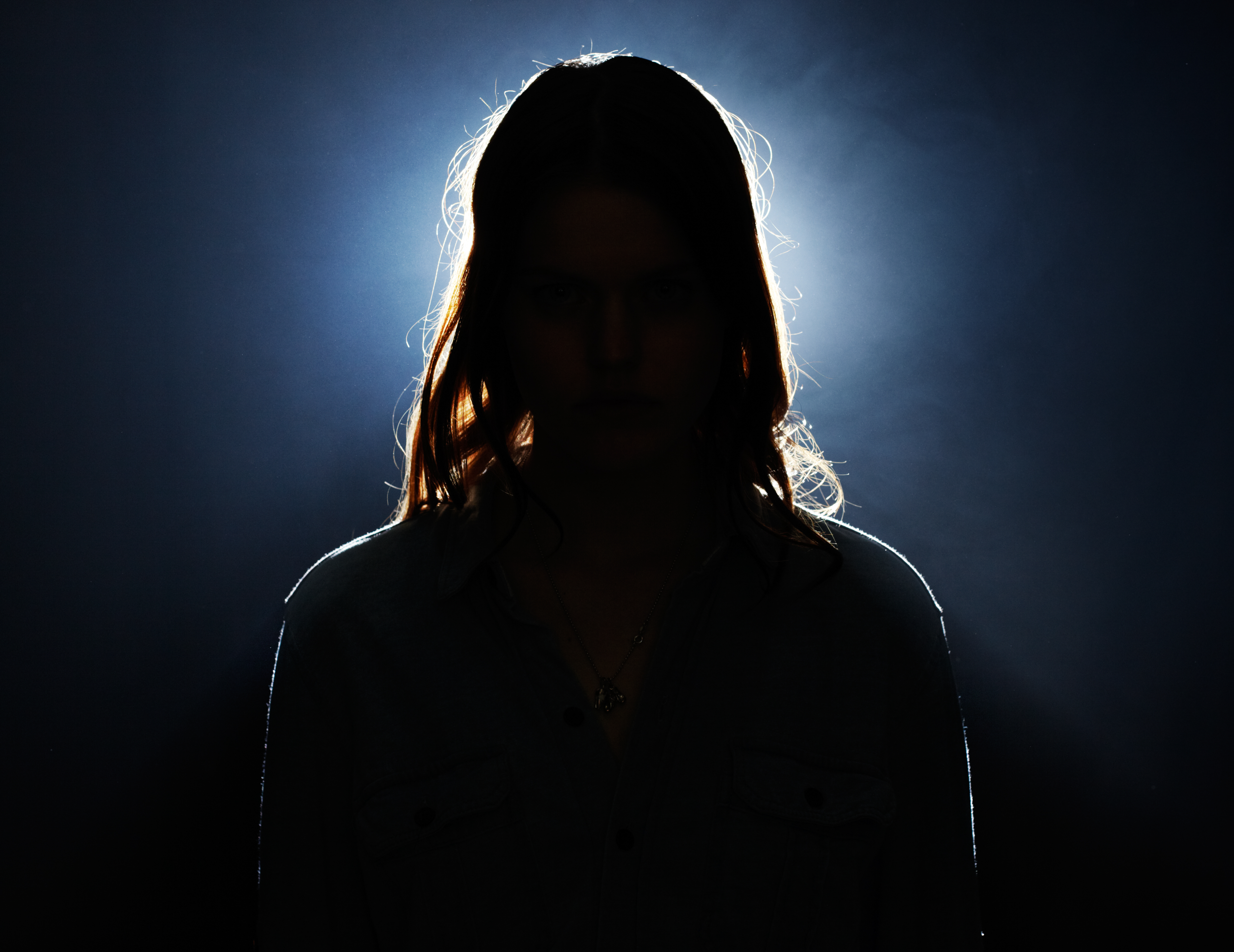 Young woman in silhouette. | Source: Getty Images