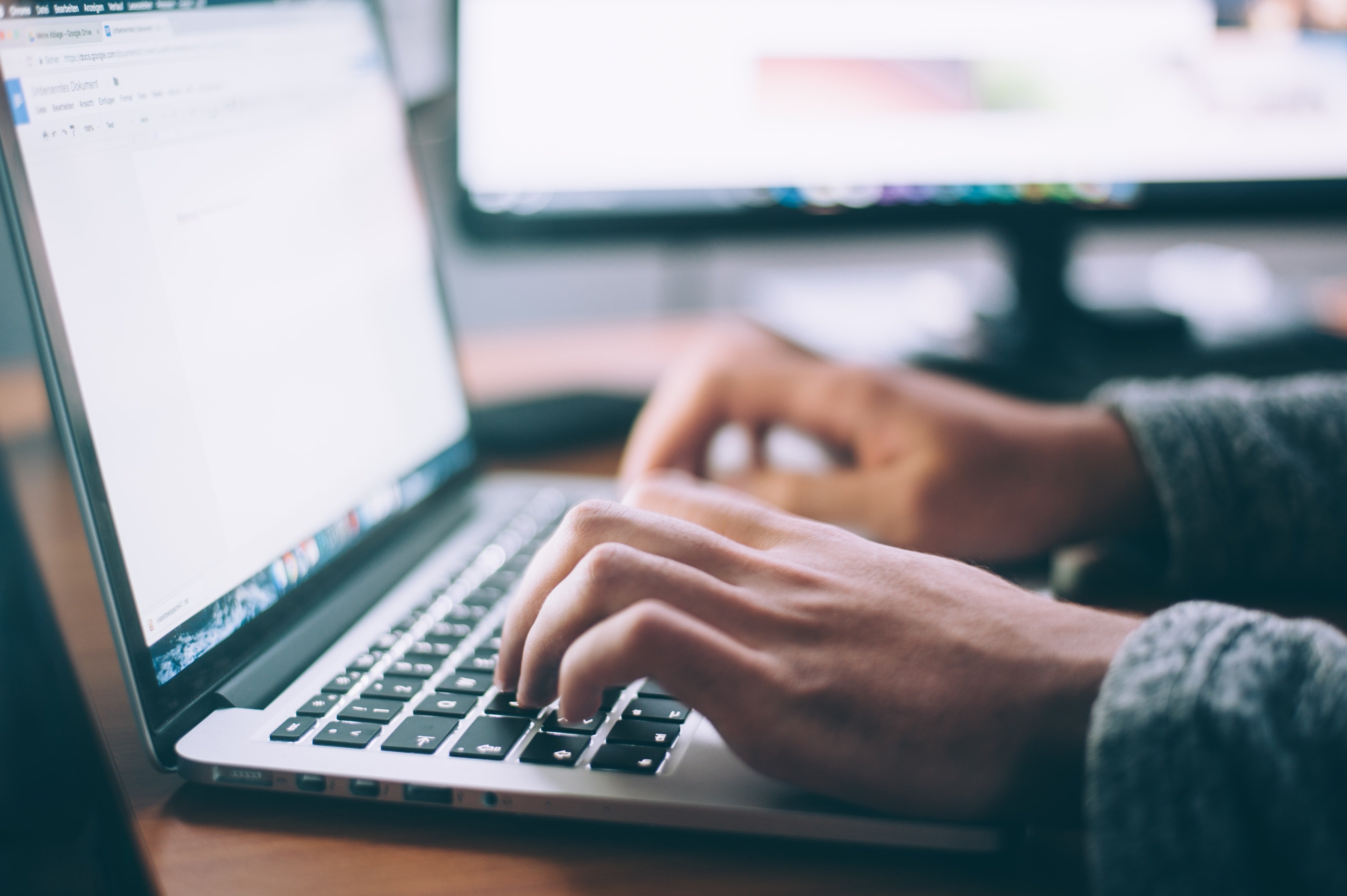 Person typing on a computer | Source: Unsplash / Glenn Carstens-Peters