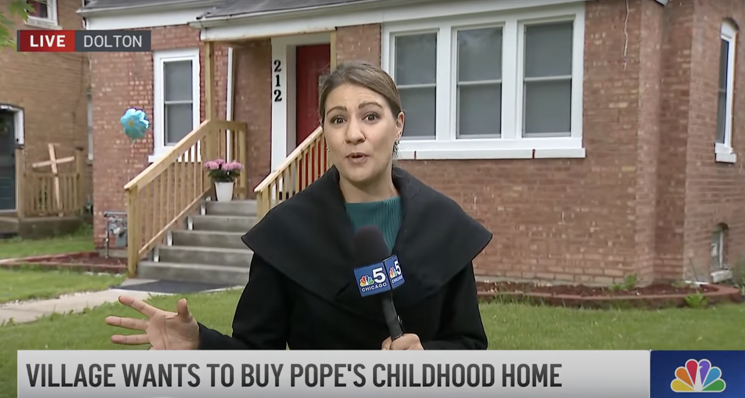 A reporter outside Pope Leo XIV's childhood home from a video dated May 23, 2025. | Source: YouTube/NBC Chicago