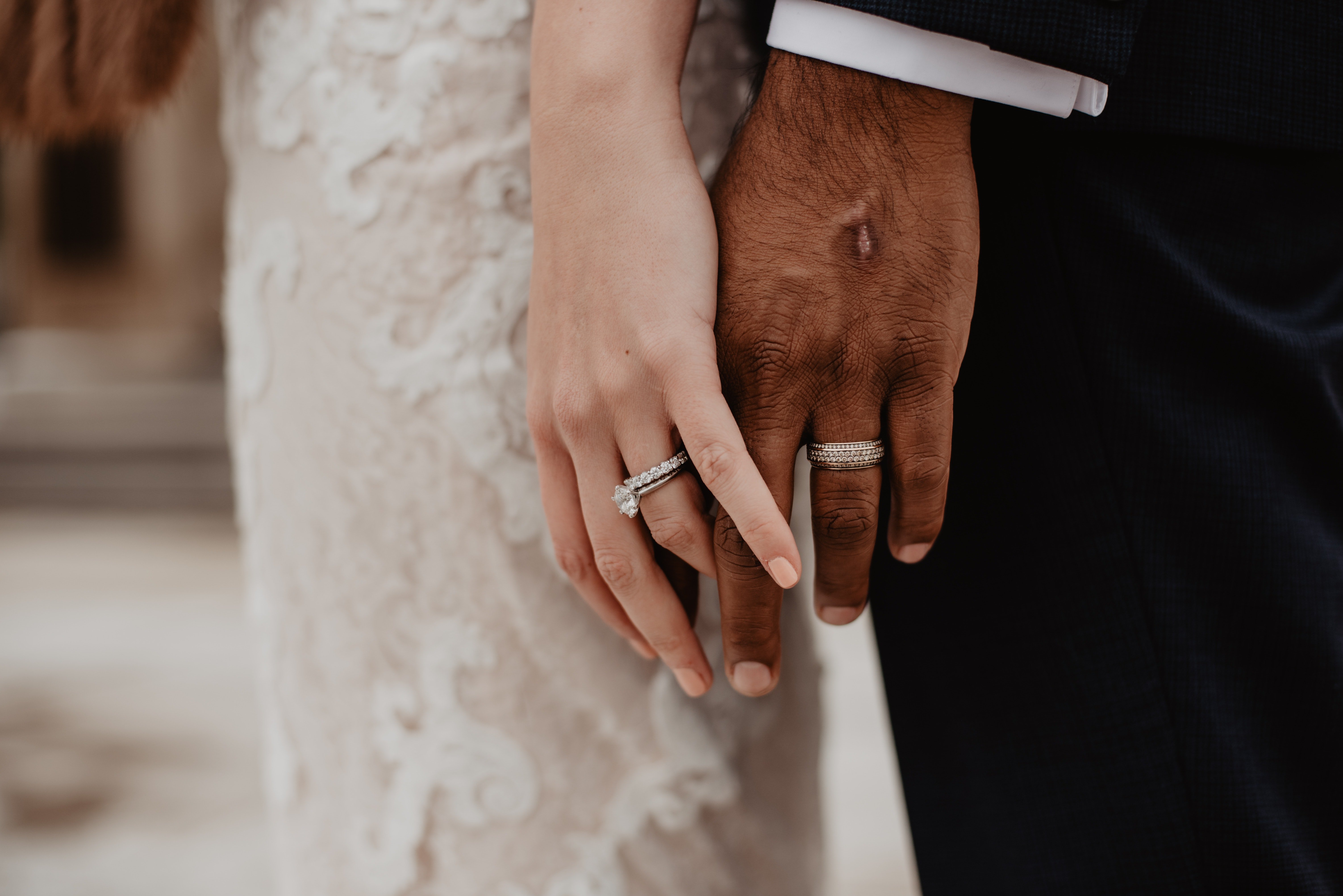 A newly wed couple holding hands. | Pexels/ Emma Bauso