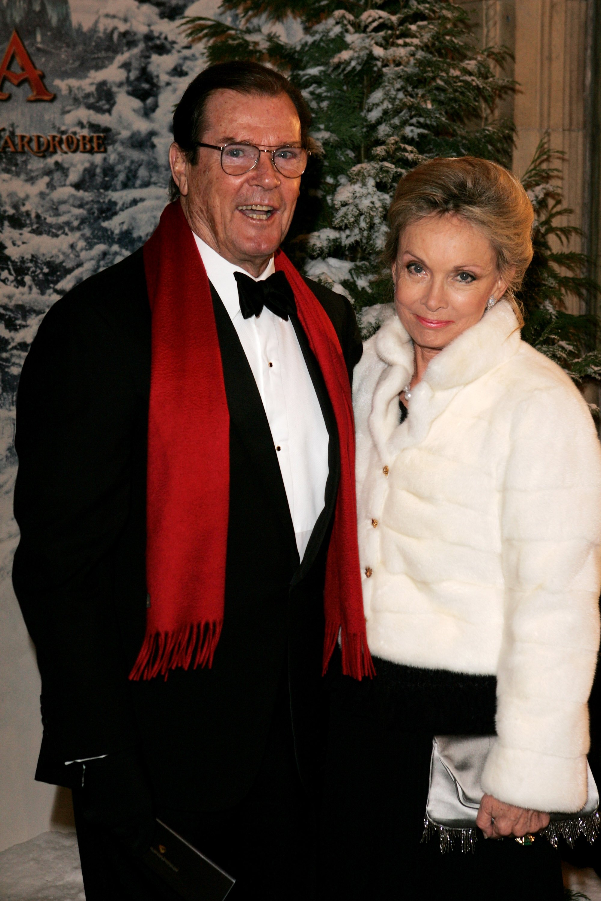 Actor Roger Moore and his wife Christina "Kiki" Tholstrup arrive at the Royal Film Performance and World Premiere of "The Chronicles Of Narnia" at the Royal Albert Hall on December 7, 2005 in London, England | Source: Getty Images