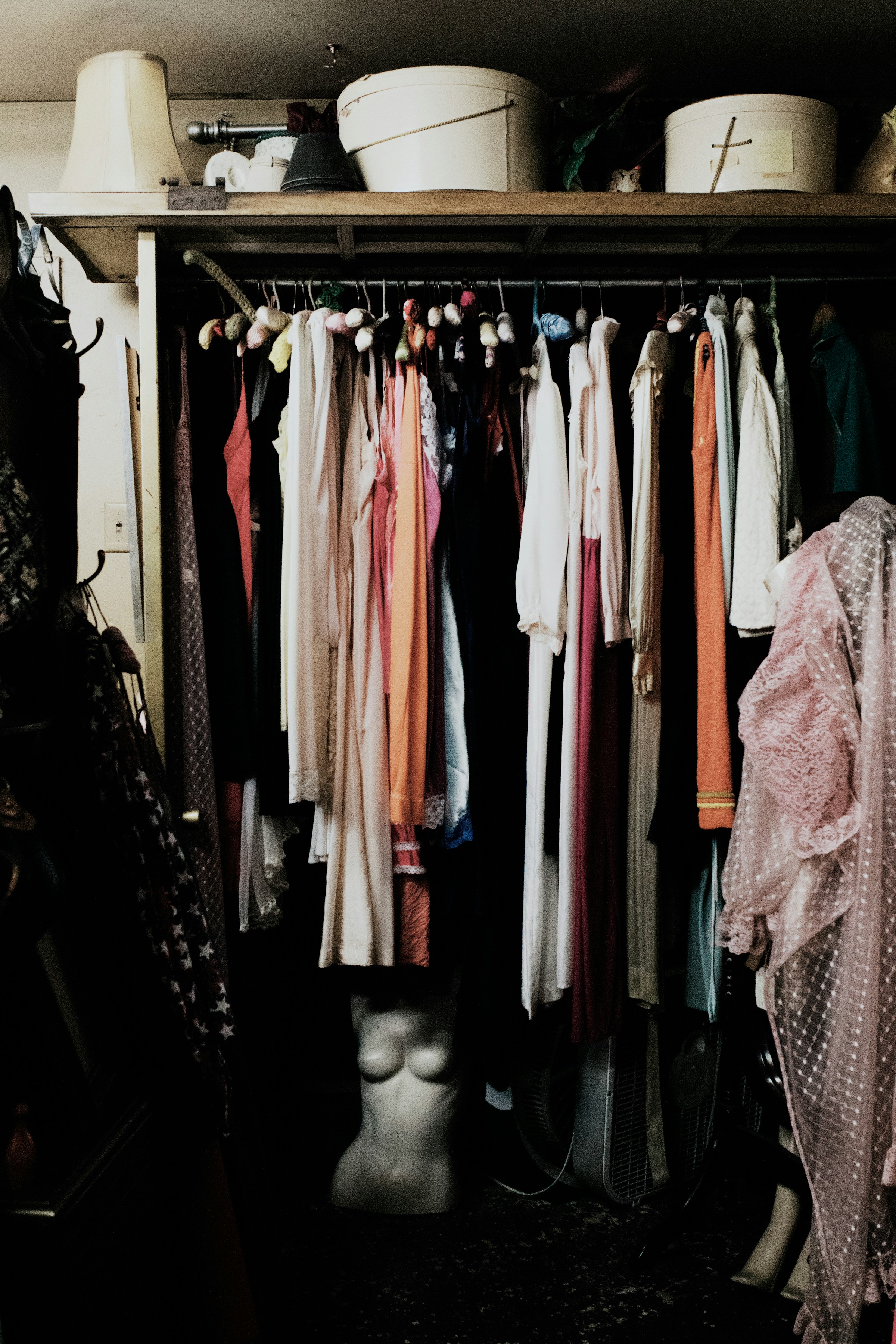 Clothes hanging in a closet | Source: Unsplash