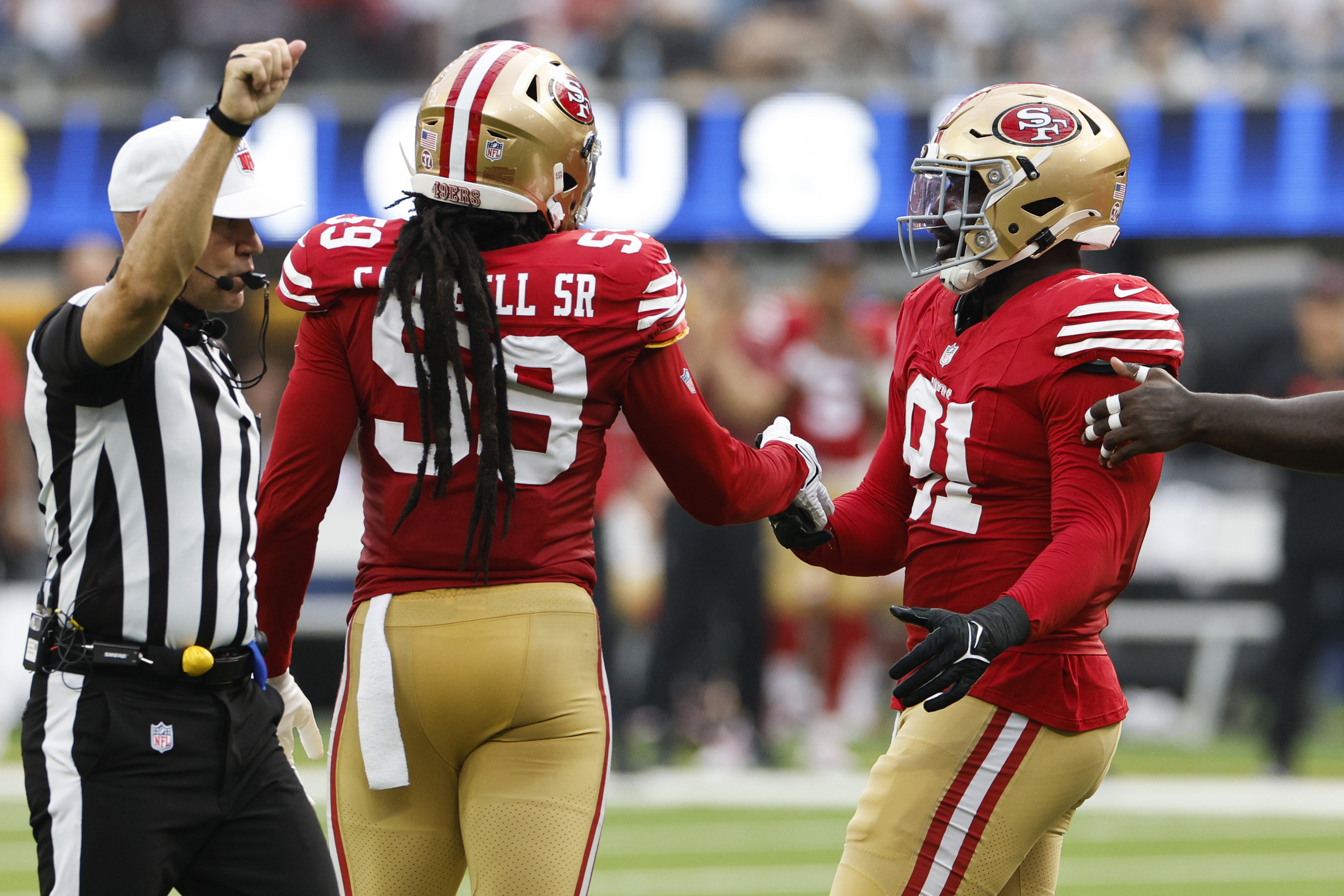 Sam Okuayinonu celebrates a sack with De'Vondre Campbell on September 22, 2024, in Inglewood, California | Source: Getty Images