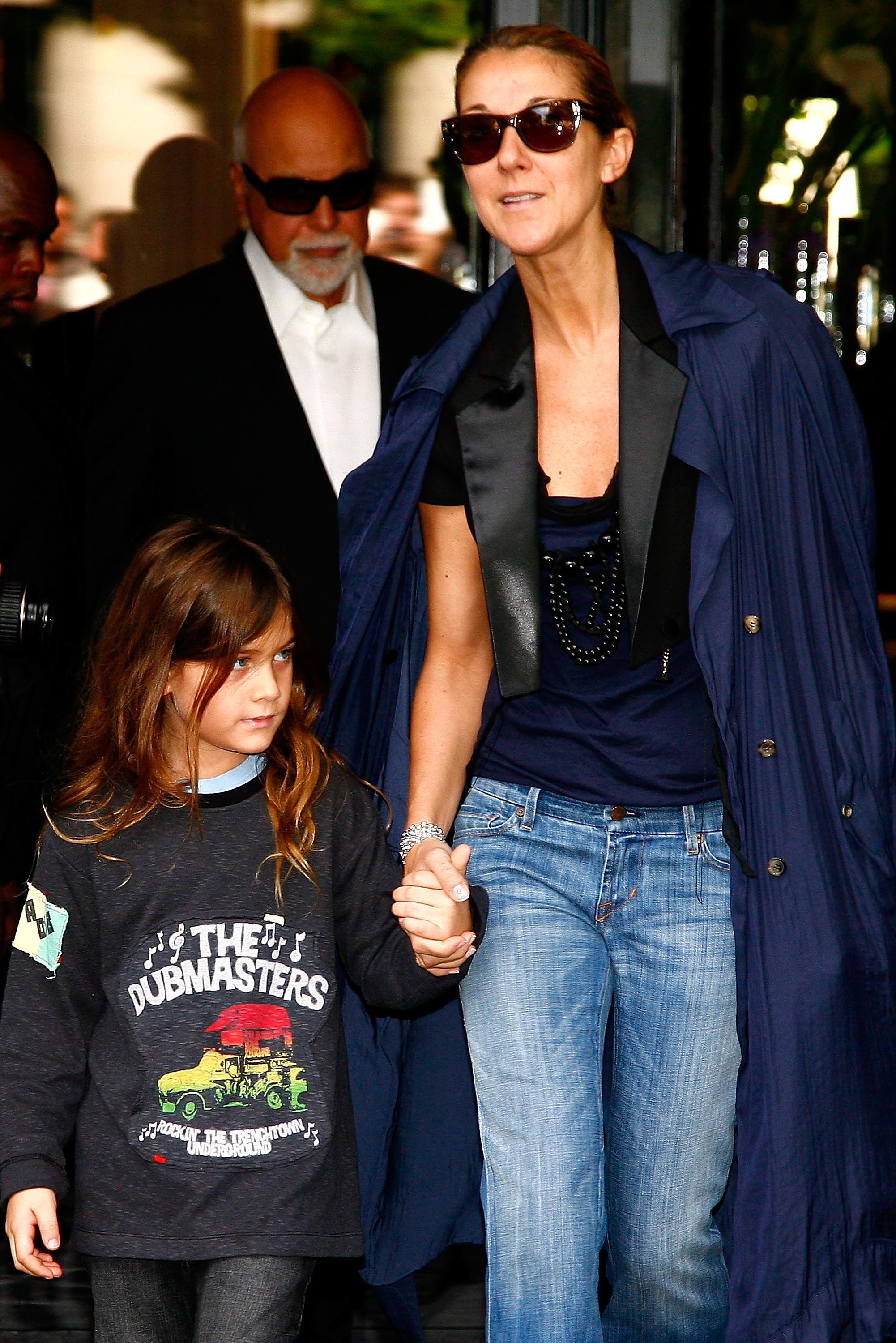 Rene-Charles, Rene Angelil (at the back), and Celine Dion leave the Four Seasons George V hotel in Paris, France on May 20, 2008 | Source: Getty Images