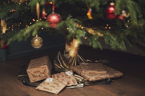  Wrapped Christmas presents under Christmas tree | Photo: Getty Images