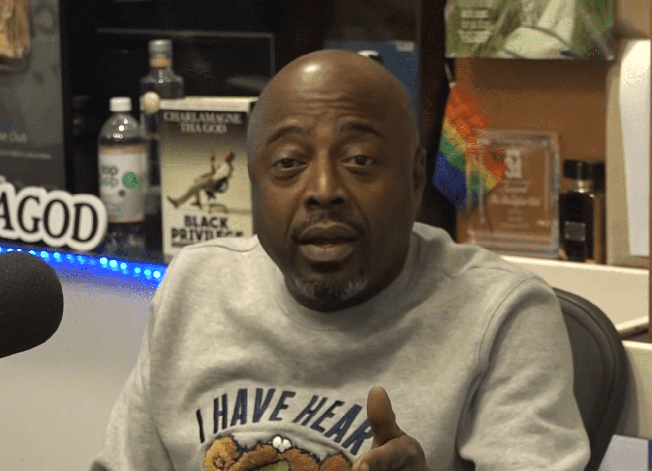 Donnell Rawlings presents his new Paper Book to "The Breakfast Club." | Photo: YouTube/ Breakfast Club Power 105.1 FM