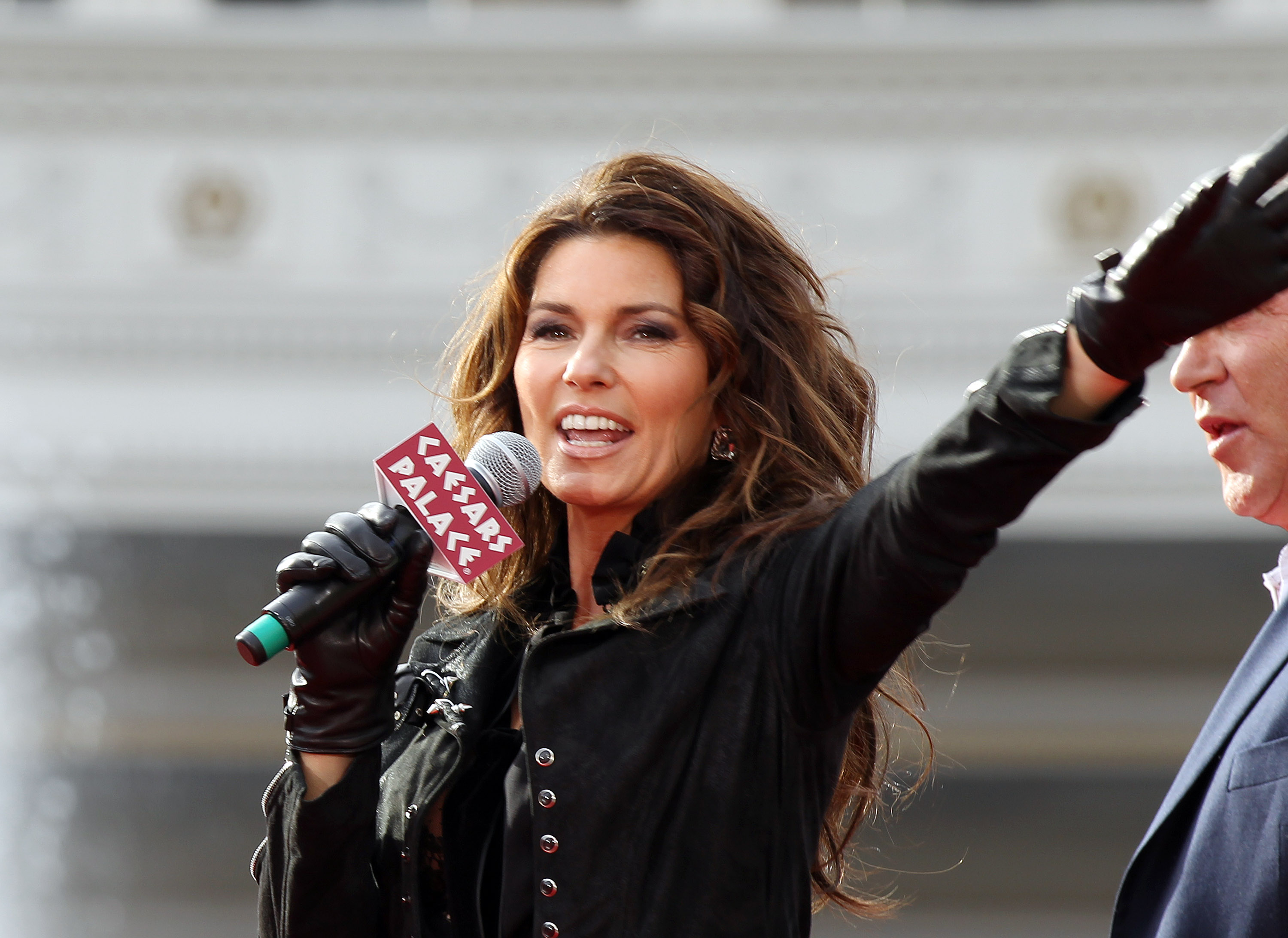 Arriving at Caesars Palace in November 2012 ahead of her Las Vegas residency, Shania Twain greeted crowd members in an edgy black suede jacket, matching leather gloves, and her signature flowing brunette waves. | Source: Getty Images