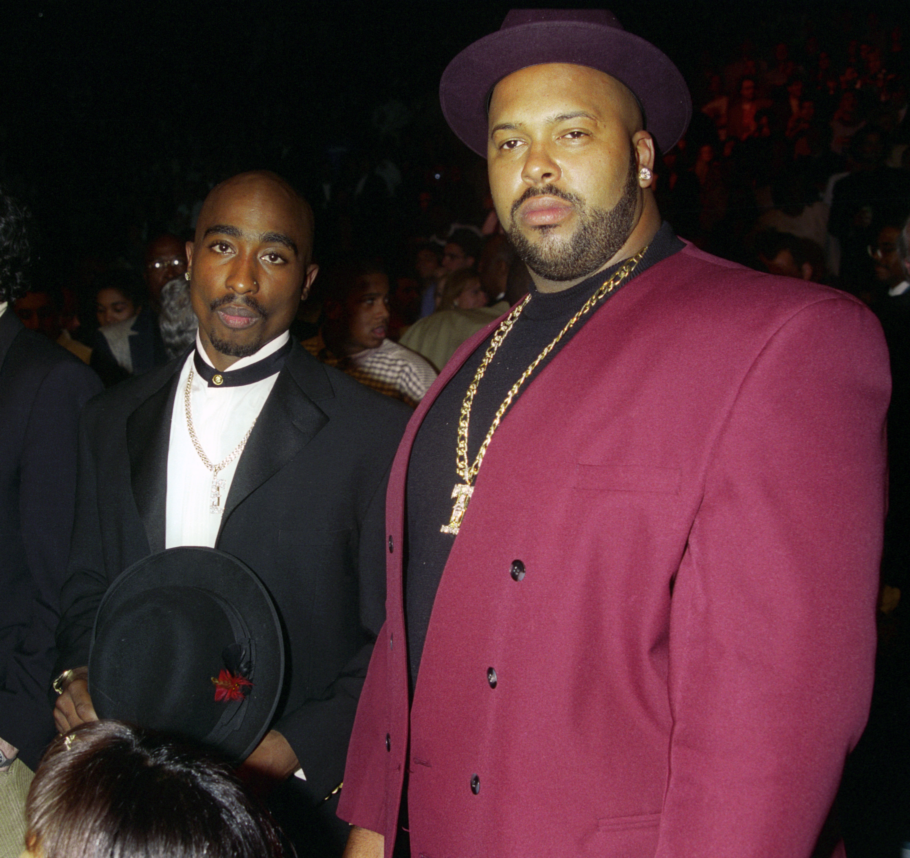 Tupac Shakur and Suge Knight at the "Tyson vs. Bruno" match at the MGM Grand Garden Arena-Backstage and Ringside on an unspecified date | Source: Getty Image