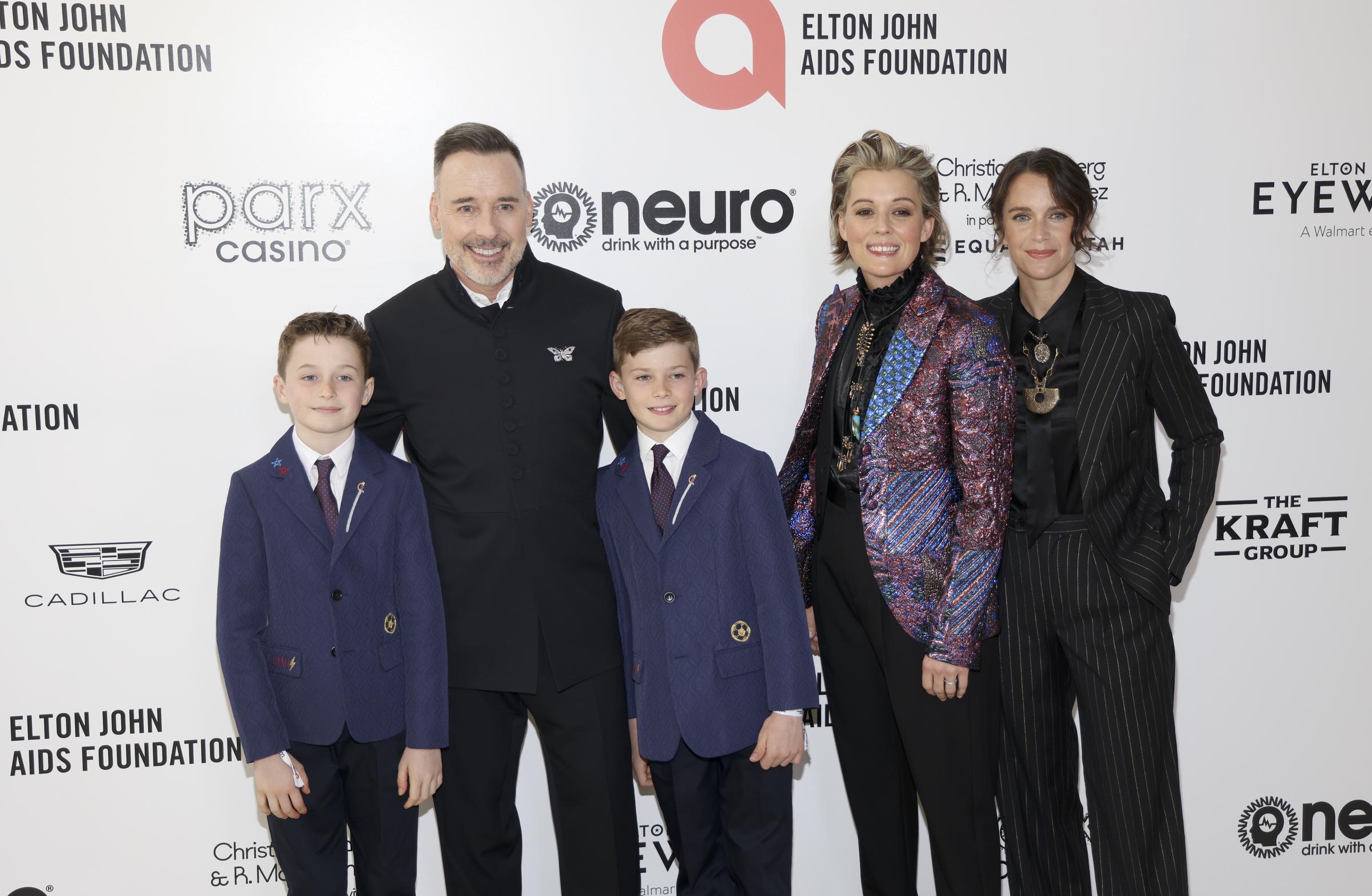 David Furnish with his sons, Elijah and Zachary Furnish-John, as well as Brandi Carlile and Catherine Shepherd at the 30th Annual Elton John AIDS Foundation Academy Awards Viewing Party on March 27, 2022, in West Hollywood, California. | Source: Getty Images