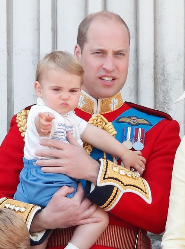 Prince William carries Prince Louis on the balcony of Buckingham Palace during Trooping The Colour. | Source: Getty Images