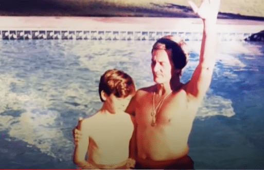 Young Ryan Corbin in the pool with his grandfather Pat Boone | Photo: YouTube/the700club