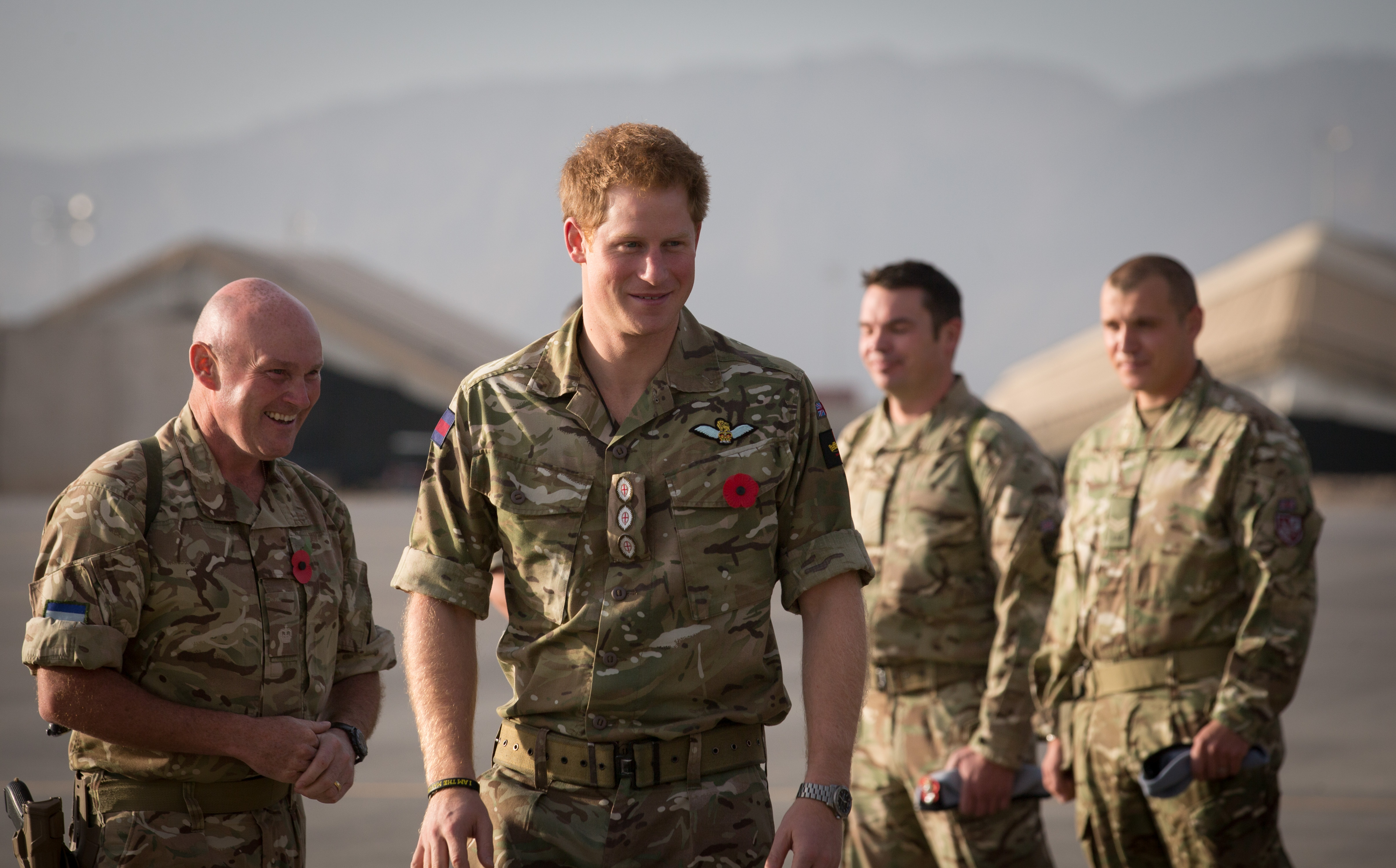 Prince Harry meeting up with British service personel following a Remembrance Sunday service at Kandahar Airfield in Kandahar, Afghanistan on November 9, 2014 | Source: Getty Images