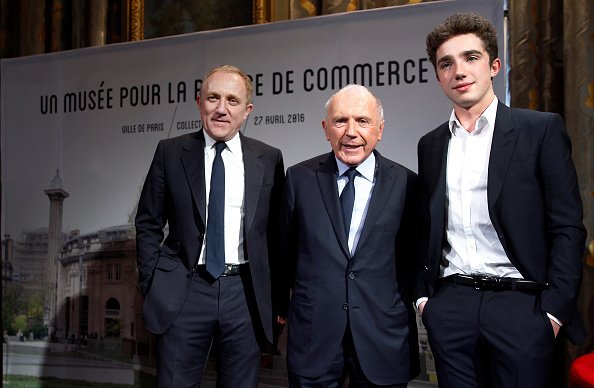Francois Pinault (C), Francois-Henri Pinault (L), and Francois Pinault (R) at the Paris Commercial Exchange on April 27, 2016 in Paris, France. | Photo: Getty Images