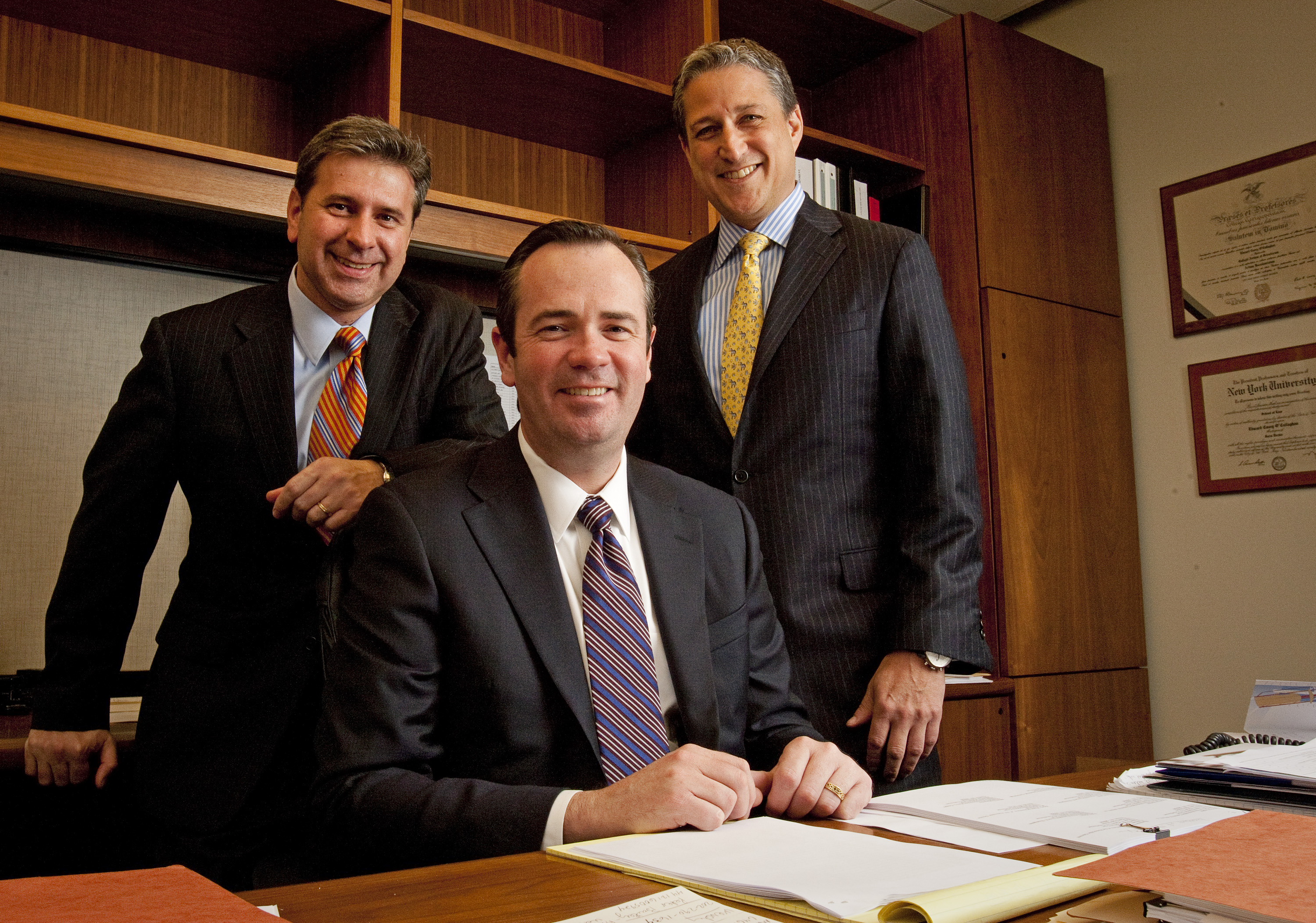 Christopher Morvillo posing for a picture with fellow Clifford Chance partners, Edward C. O'Callaghan, and David B. Raskin, in New York on December 21, 2011 | Source: Getty Images