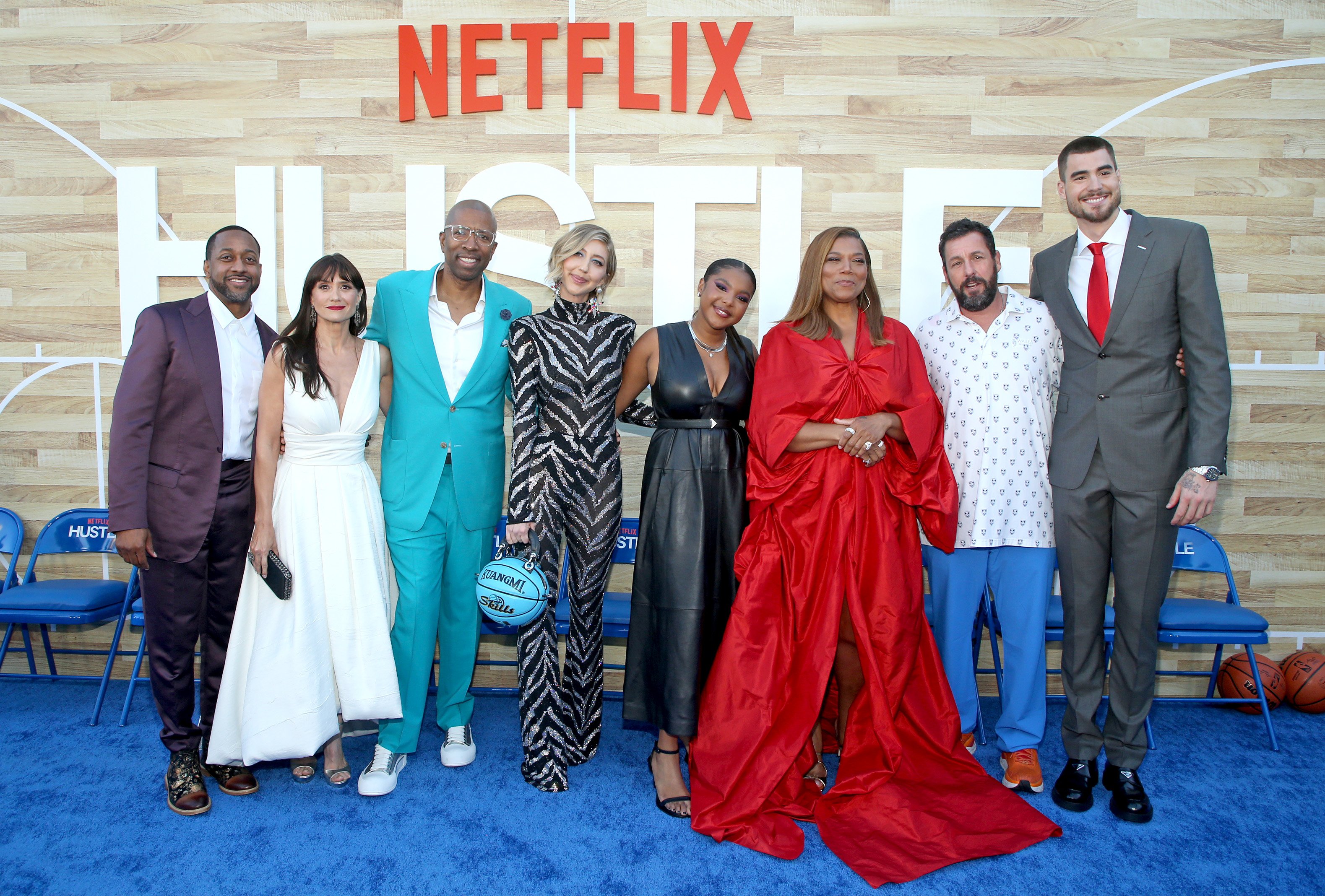 Jaleel White, Maria Botto, Kenny Smith, Heidi Gardner, Jordan Hull, Queen Latifah, Adam Sandler, and Juancho Hernangomez at the Netflix World Premiere of "Hustle" on June 1, 2022 | Source: Getty Images