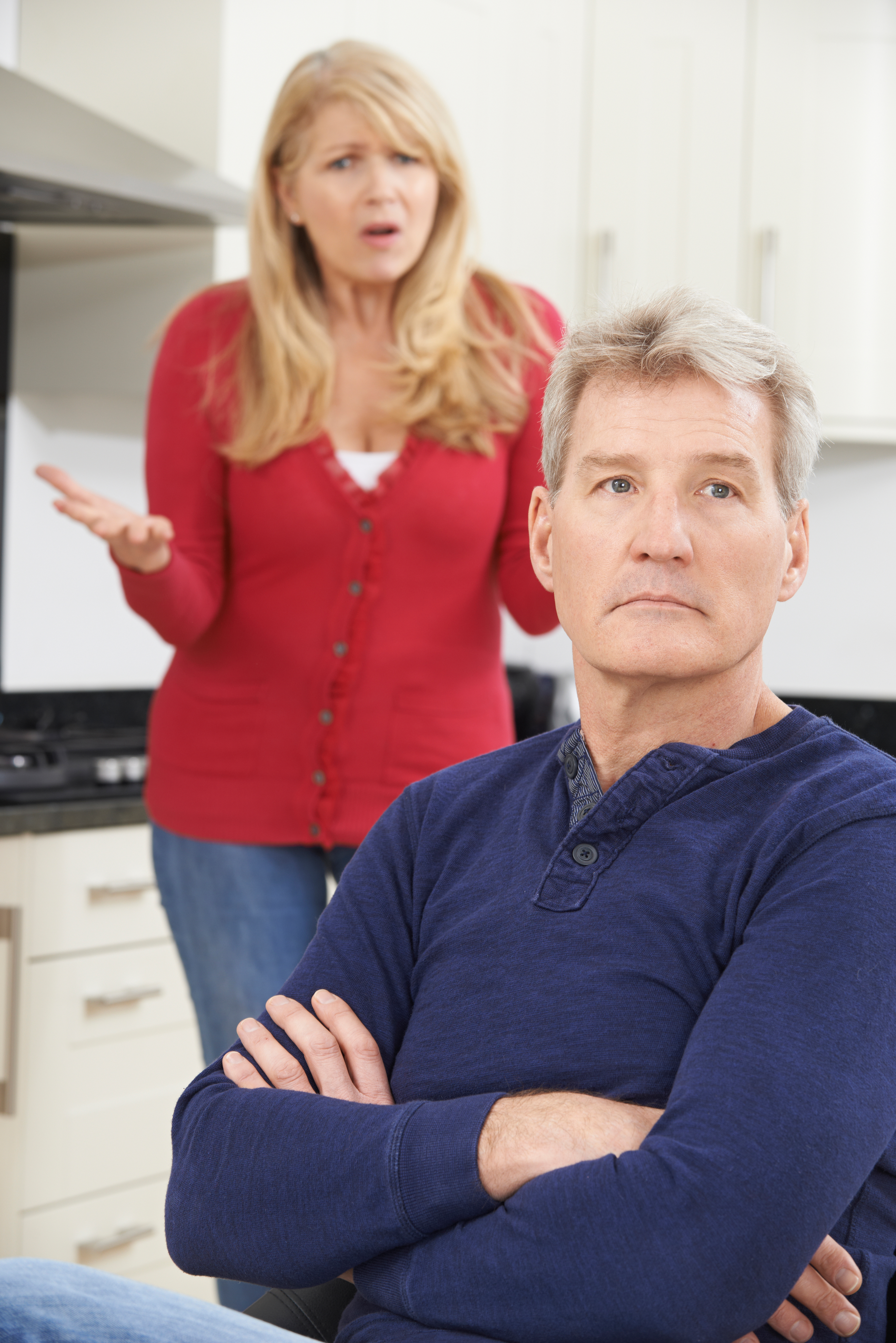 A middle-aged couple arguing at home | Source: Shutterstock