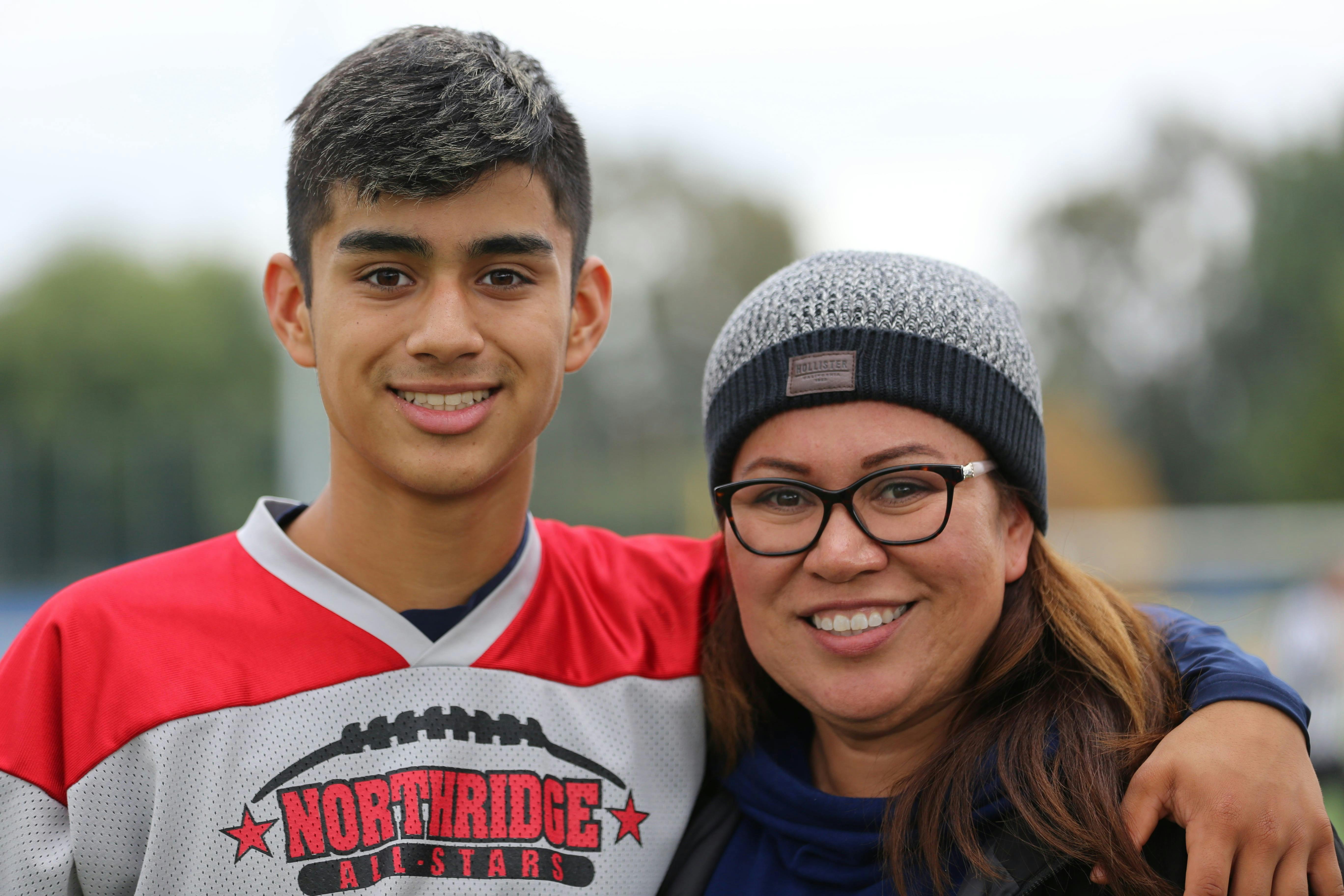 A happy mother and son embracing | Source: Pexels