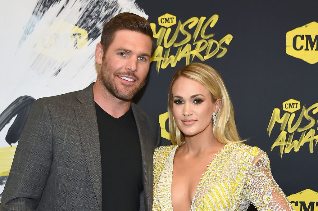 Mike Fisher and Carrie Underwood at the CMT Music Awards at Bridgestone Arena on June 6, 2018, in Nashville, Tennessee | Photo: Getty Images/ Rick Diamond