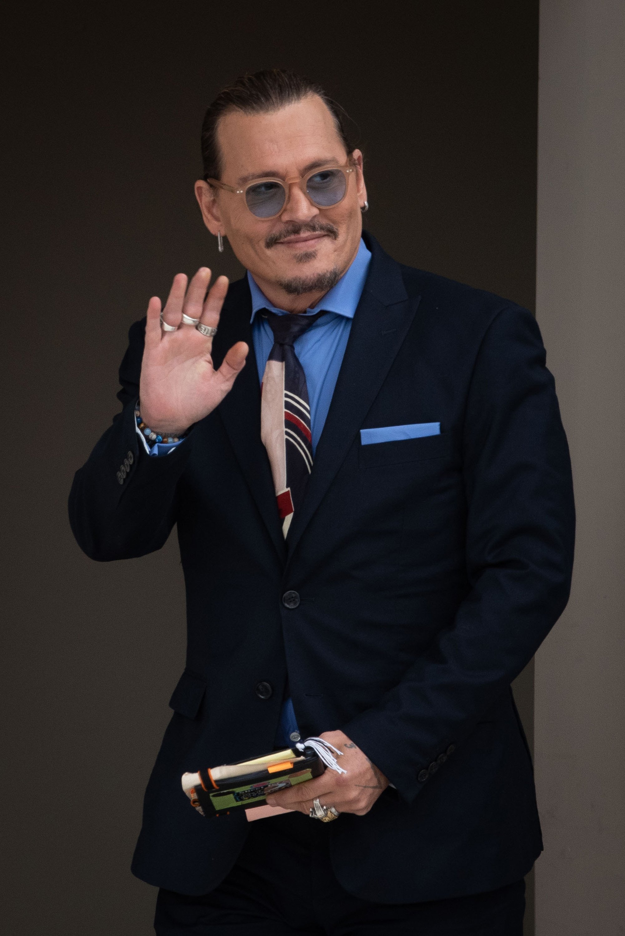 Johnny Depp waves to his fans outside the court on May 5, 2022 | Source: Getty Images