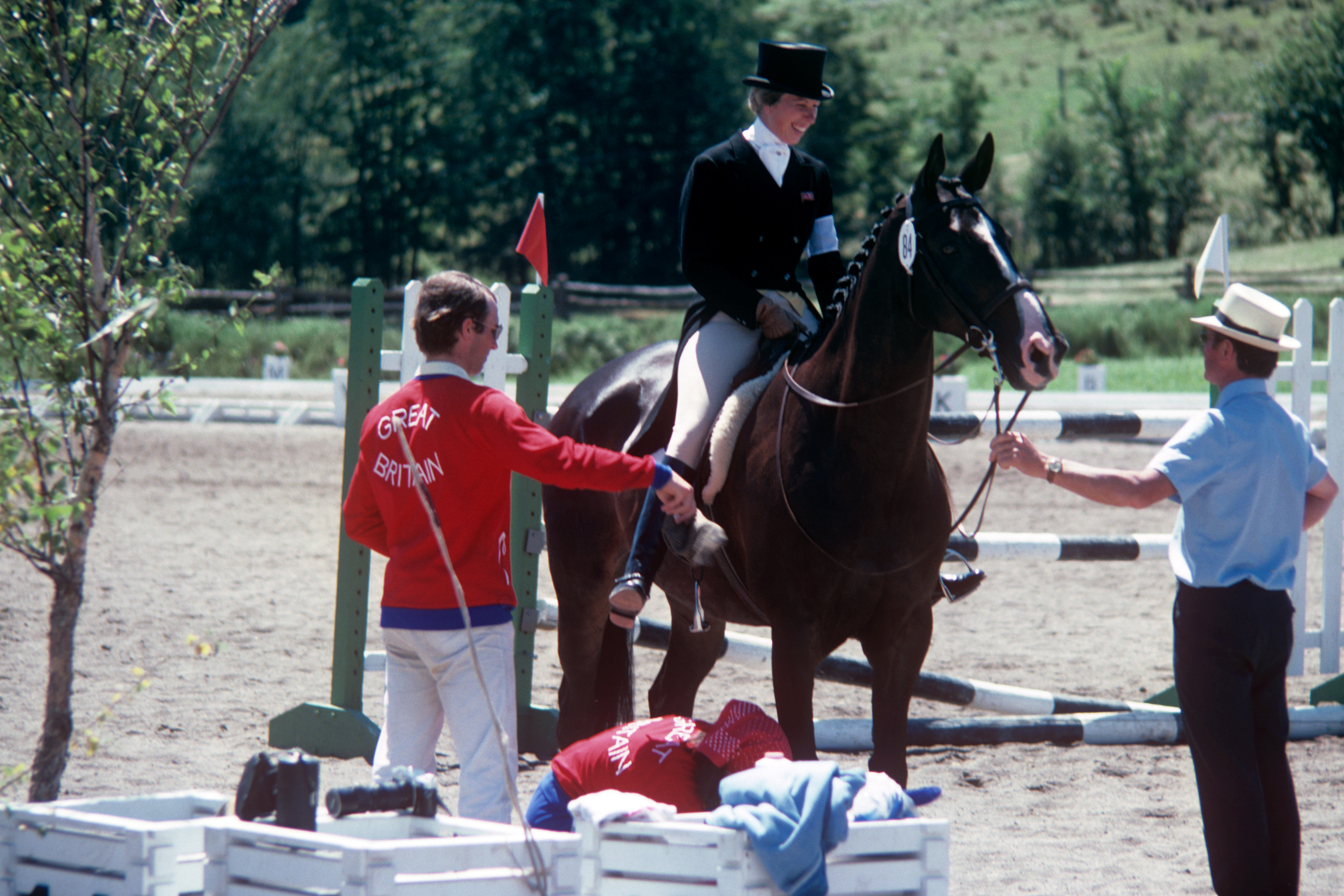 Captain Mark Phillips helps his ex-wife, Princess Anne, onto her horse, Goodwill, during the Three Day Eventing at the Montreal Olympic Games in 1976. | Source: Getty Images