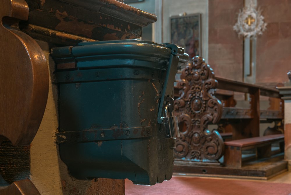 Closed donation box for donations in a church | Getty Images