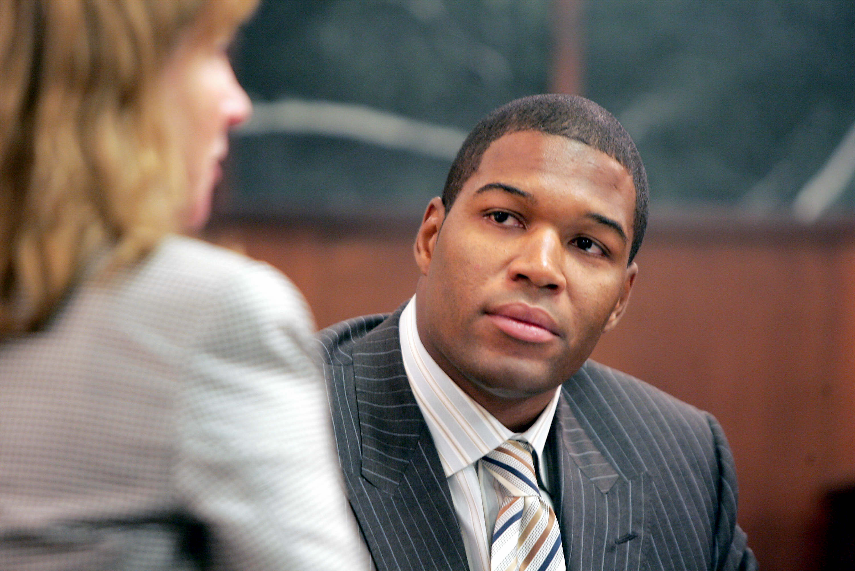 Michael Strahan on the last day of divorce proceedings with his estranged wife, Jean, at Essex County Family Court in Newark, New Jersey, on July 20, 2006 | Source: Getty Images