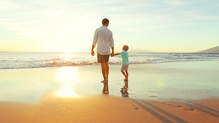 A father walking with his son | Photo: Shutterstock