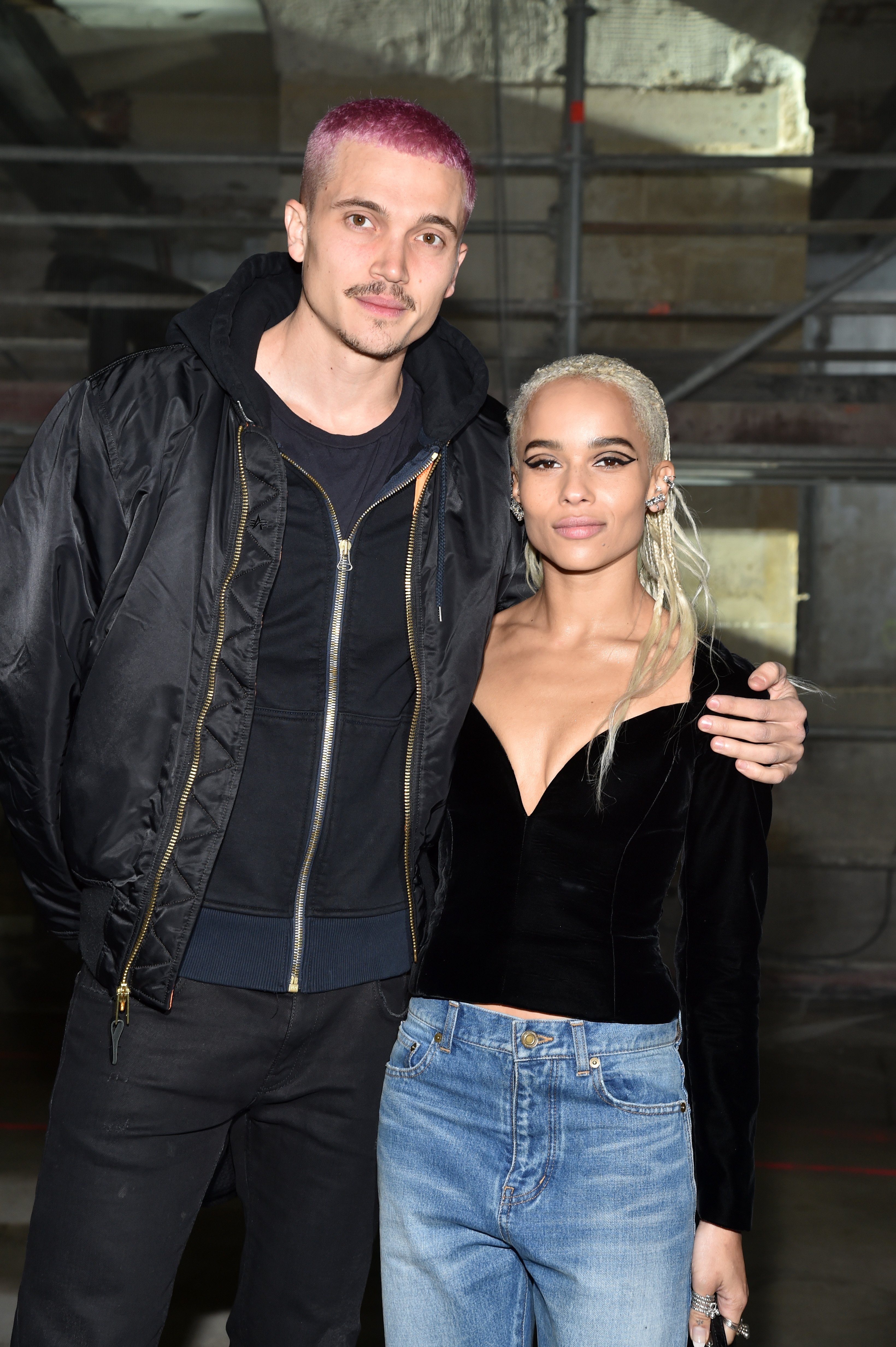  Karl Glusman and Zoe Kravitz attend the Saint Laurent show as part of the Paris Fashion Week on February 28, 2017. | Source: Getty Images 