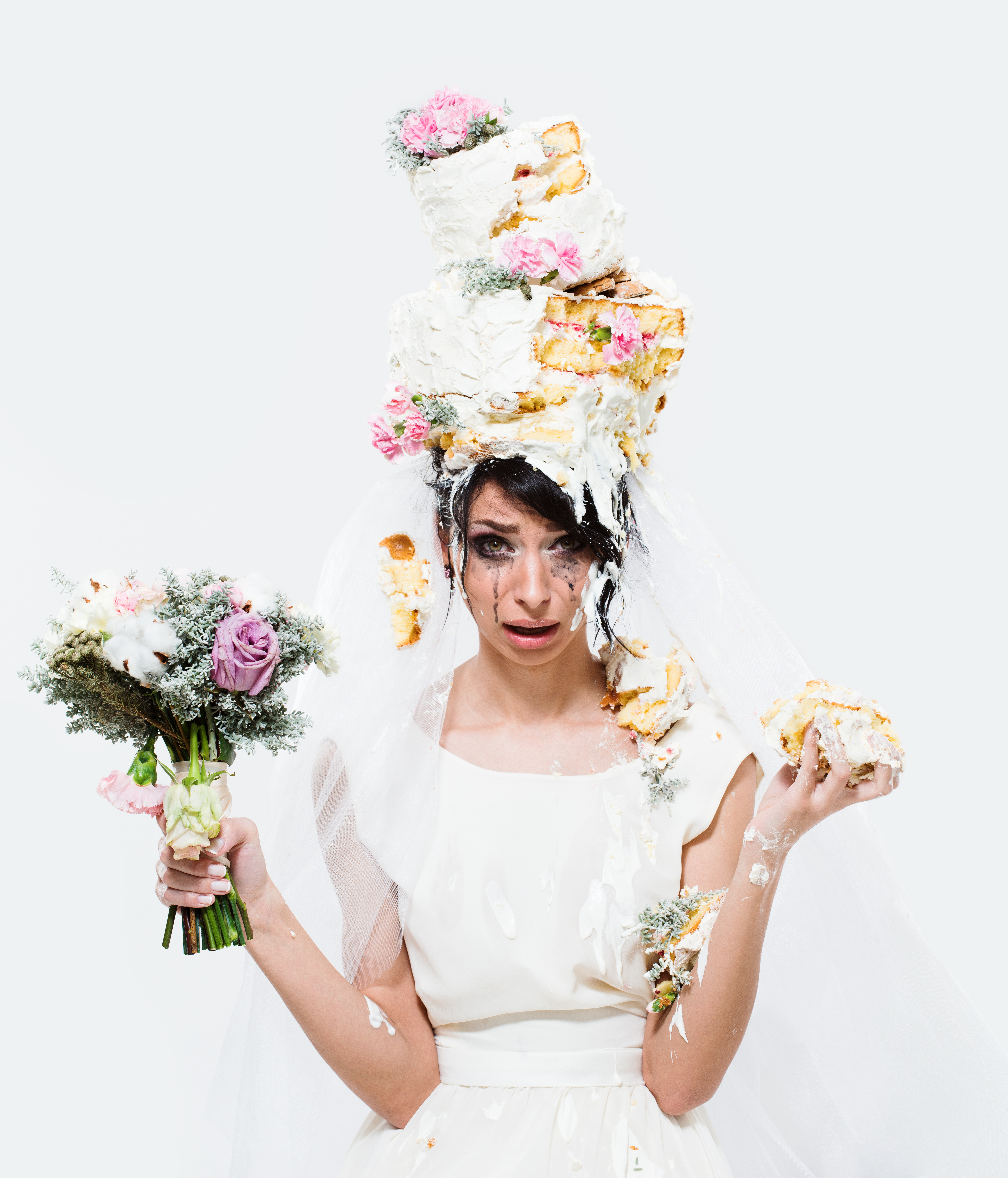 Crying bride with cake on head | Source: Shutterstock